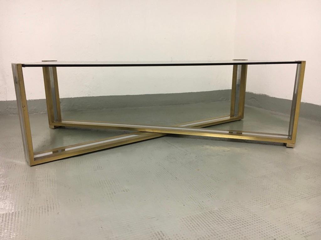 Chrome, brass and smoked glass coffee table by Romeo Rega, Italy, circa 1970.
Good condition.
Measures: 110 x 63 x 35 cm.
