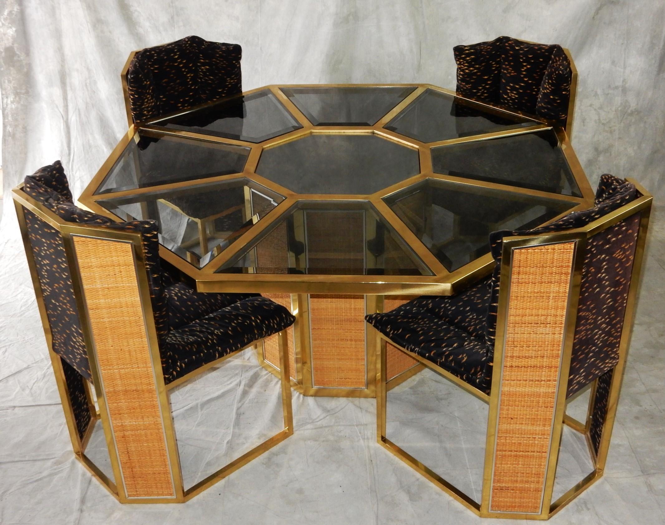 Circa 1970's Romeo Rega design for Mario Sabot dining table and 4 chairs.
Lovely combination of brass, smoke glass and wicker trimmed in chrome make this set a standout in any decorum. Crafted in Italy.
The table and chairs have been deep cleaned