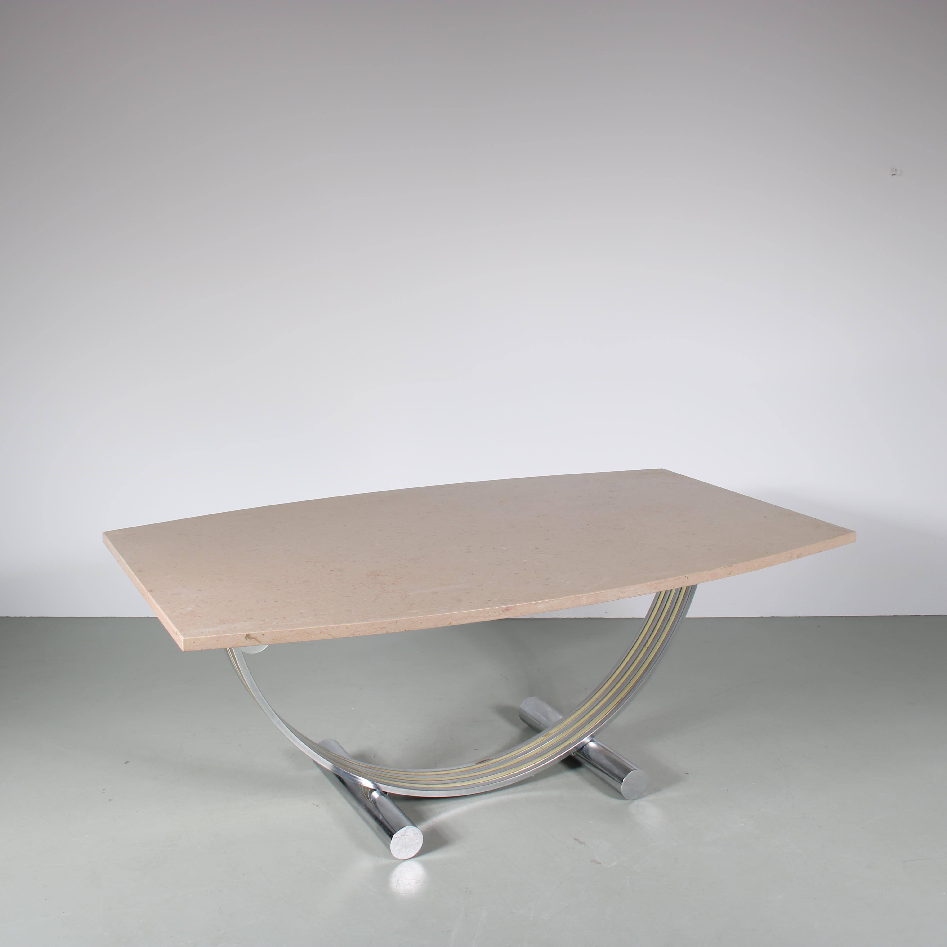 A wonderful dining table, designed by Romeo Rega and manufactured in Italy around 1970.

The unique frame of the table has chrome plated, tubular metal legs and supports connected by a large half-circle shaped frame in chrome and gold plated