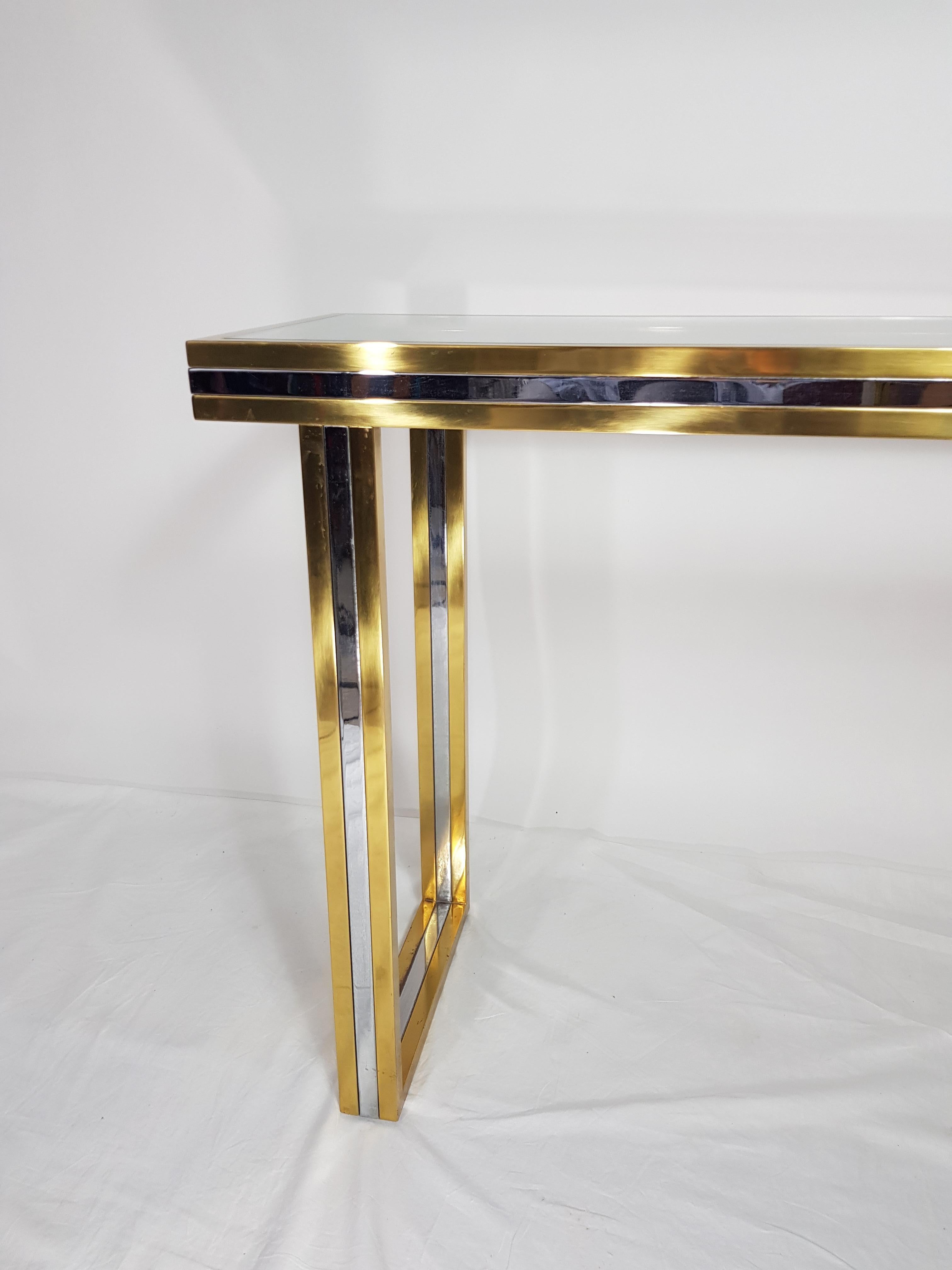 Gold brass and silver chrome with a recessed glass tray large console table, from the designer Roméo Rega
Itaty, 1970s.
 