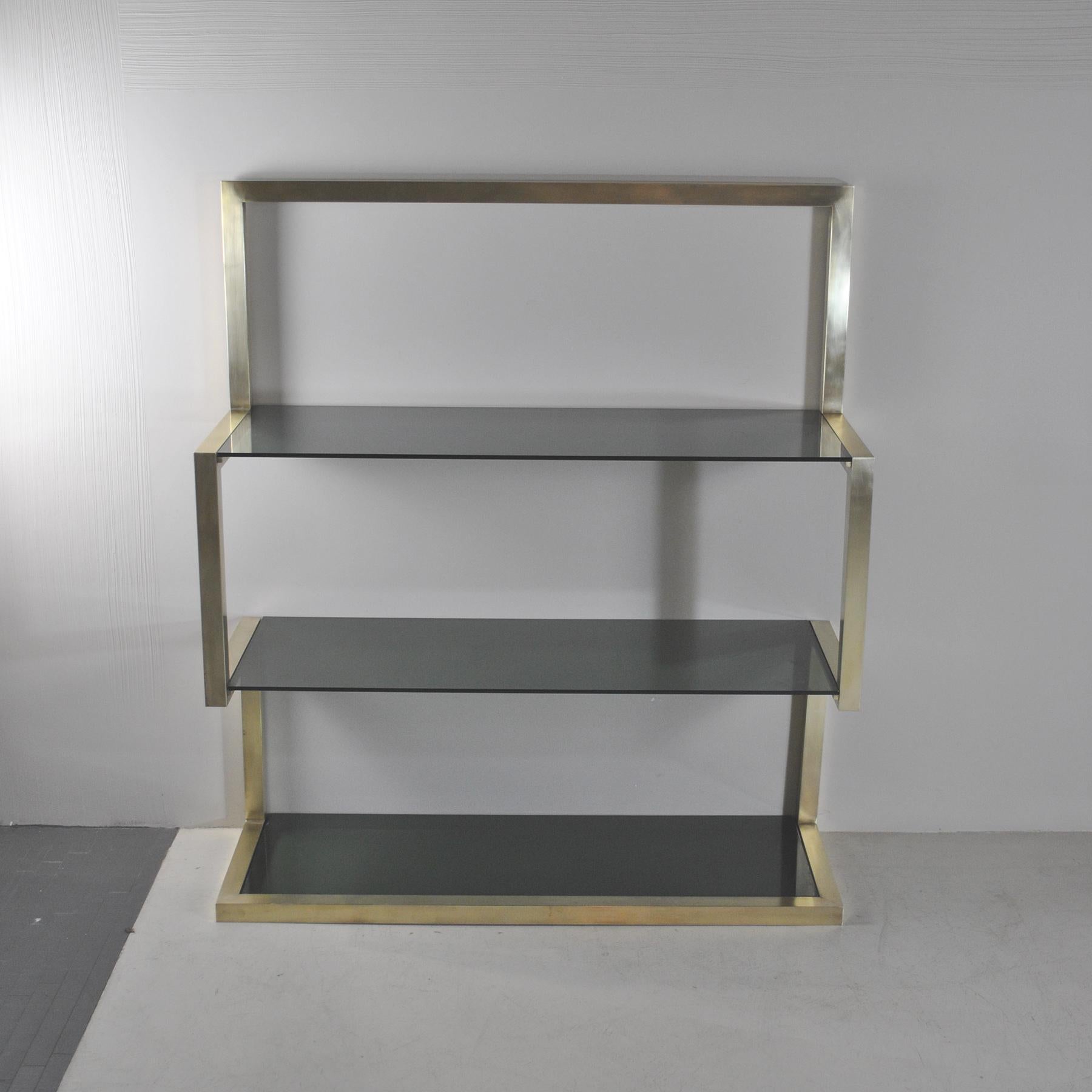 Lovely and ergonomic little bookcase or showcase in the manner of Romeo Rega, brass structure with smoked glass mid 70's ca.