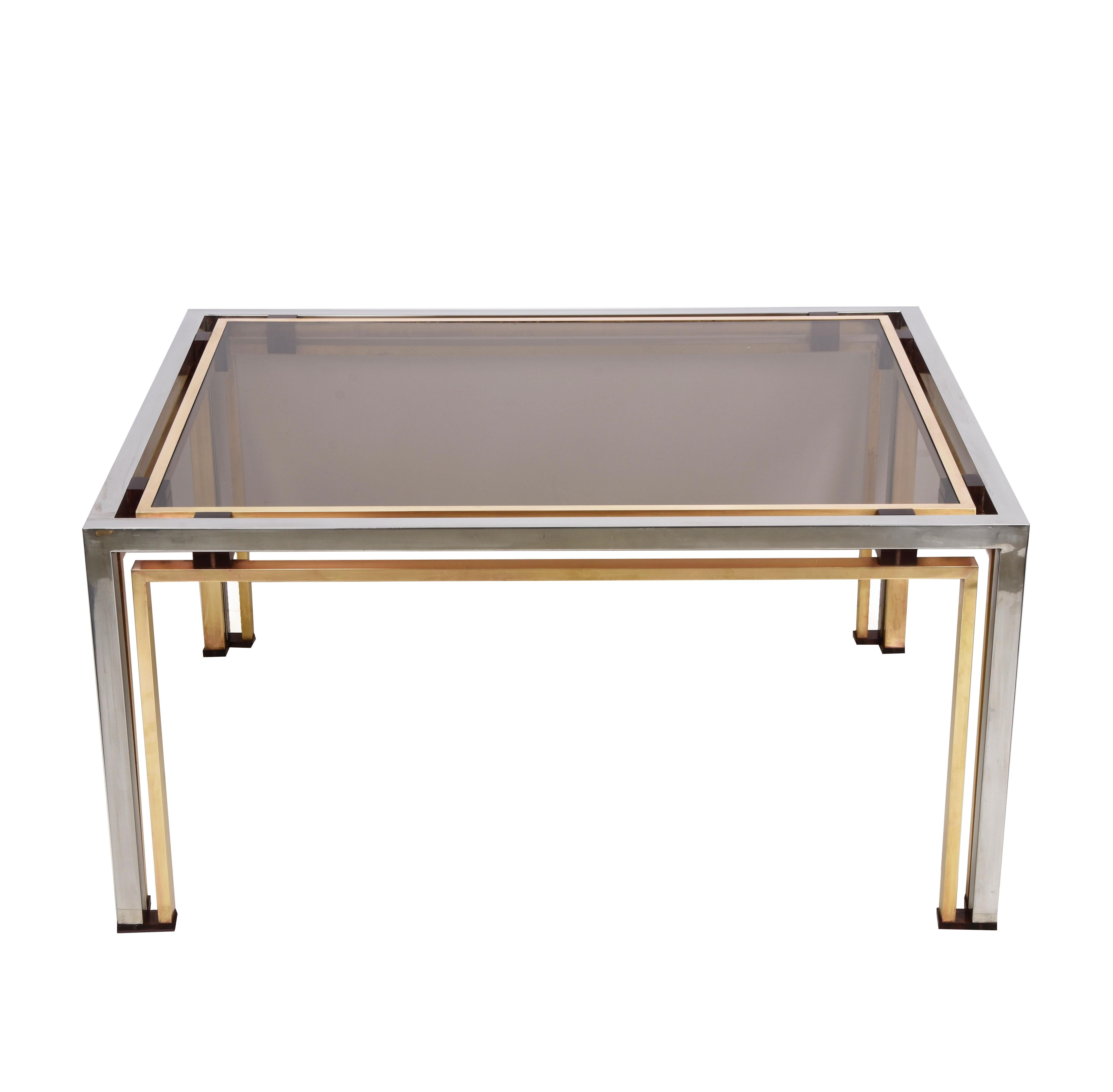 Mid-Century solid brass and chromed coffee table with smoked glass top and amethyst Lucite blocks. This fantastic object was designed by Romeo Rega in Italy in the 1970s.

This coffee table, thanks to the chromed metal and brass structure, and