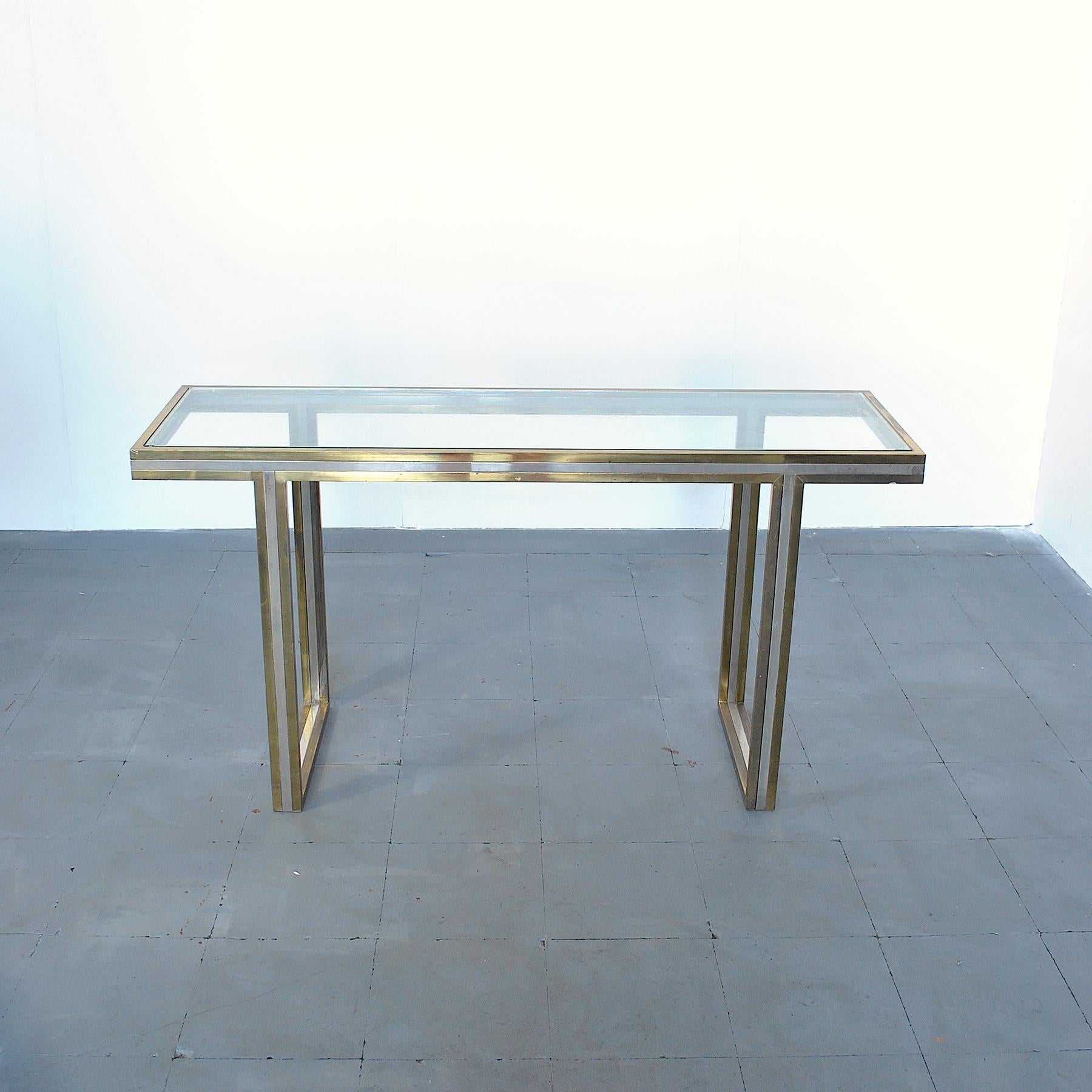 Rectangular console in brass and steel with glass top designed and produced by Romeo Rega in the mid-1970s.