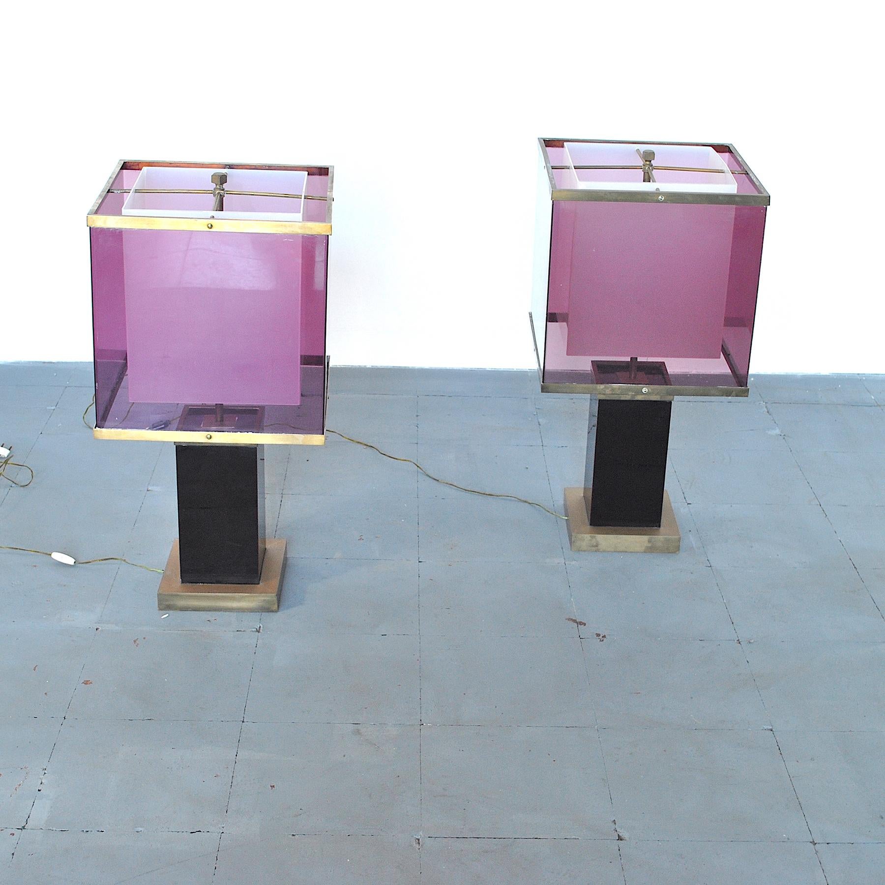A set of two table lamps by Romeo Rega designer in brass and white and light purple perplex.