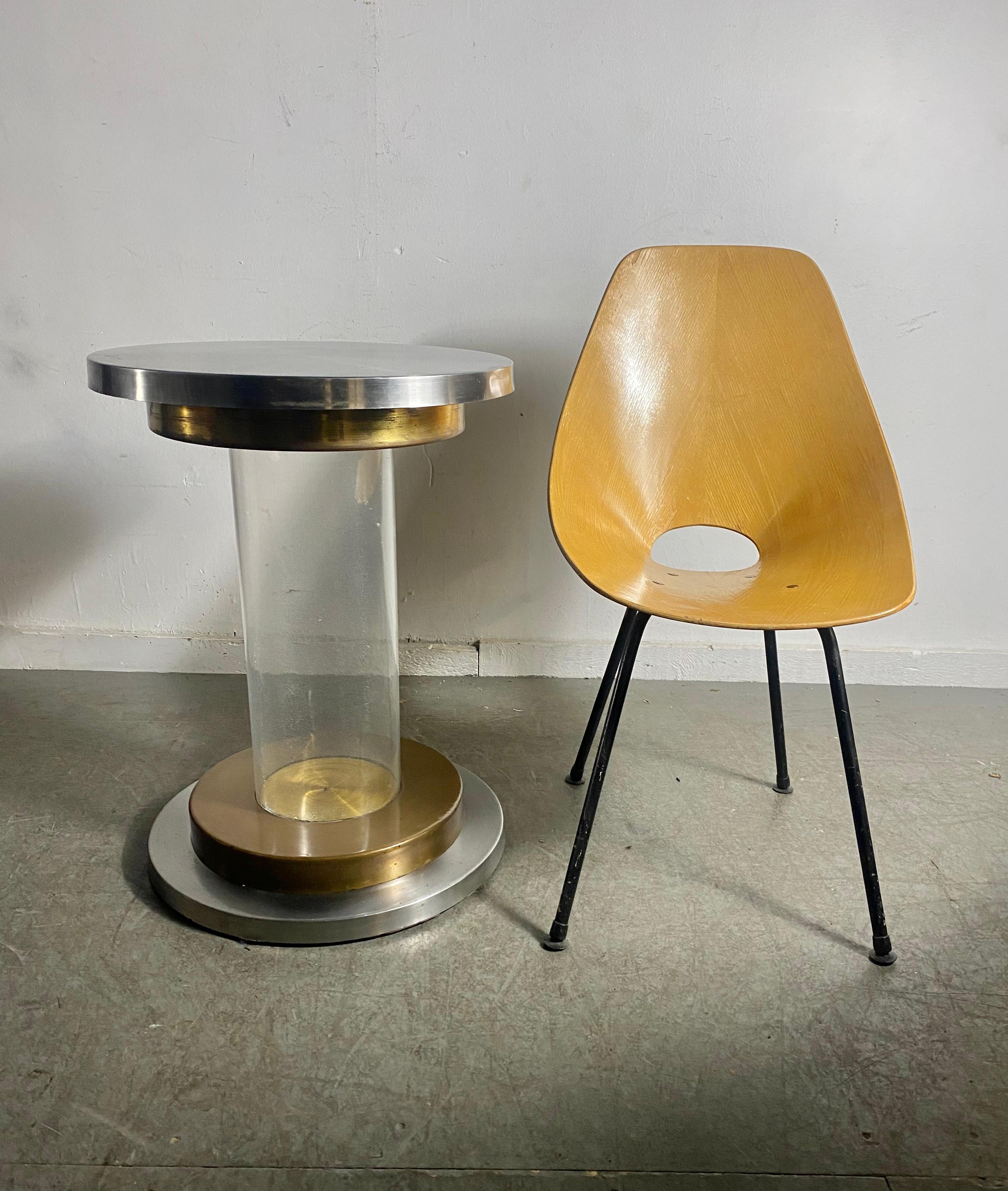 Italian lucite, brass and aluminum pedestal table base, ( ONLY) circa 1970s.
Created by artist Romeo Rega. Base diameter measures 19