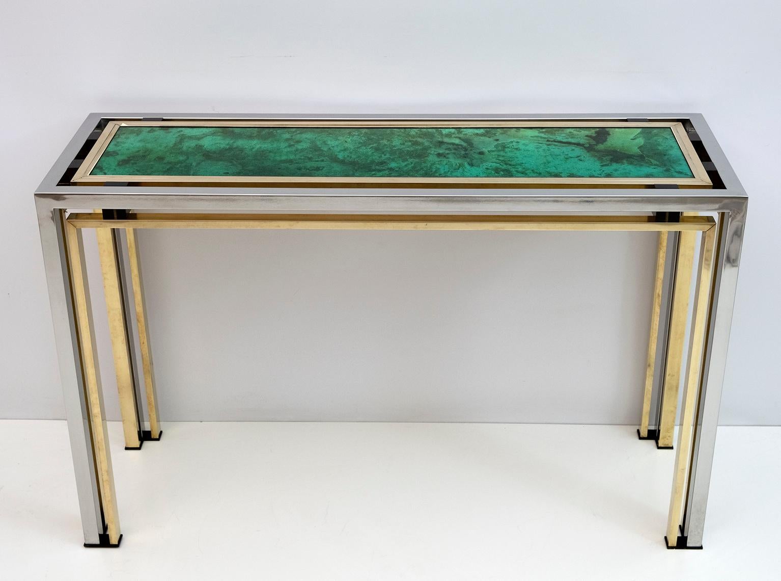 Gorgeous console in brass and chromed metal from the 70s with upper console in artistic glass and parts in bakelite, designed by Romeo Rega. The console carries the fima at the bottom, as shown in the photo. In excellent condition.