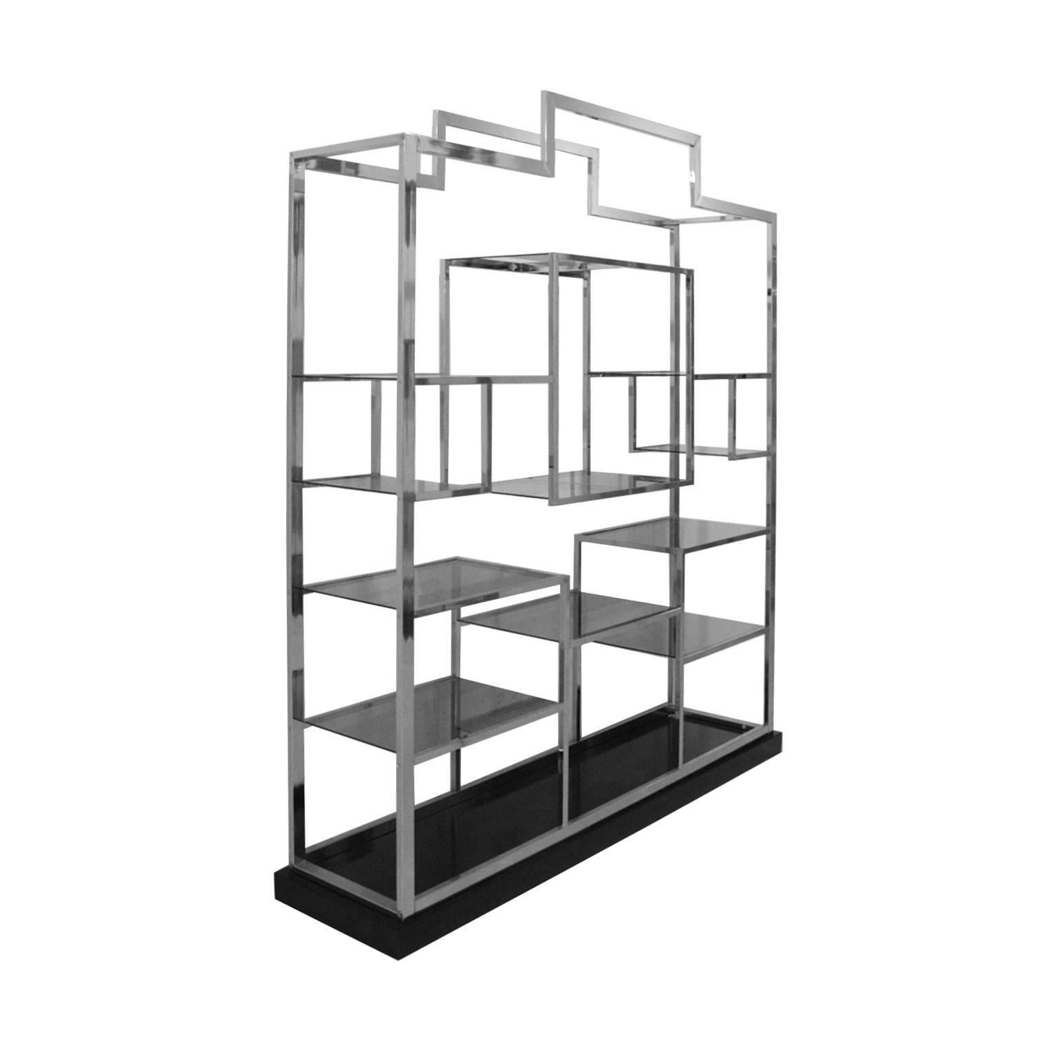 Large shelve designed by Romeo Rega. Structure made of square steel frame and black lacquer wood base. Composed by eleven shelves made of dark crystal.

Romeo Rega is one of several 1970s-era Italian designers. Rega’s work is common among lovers