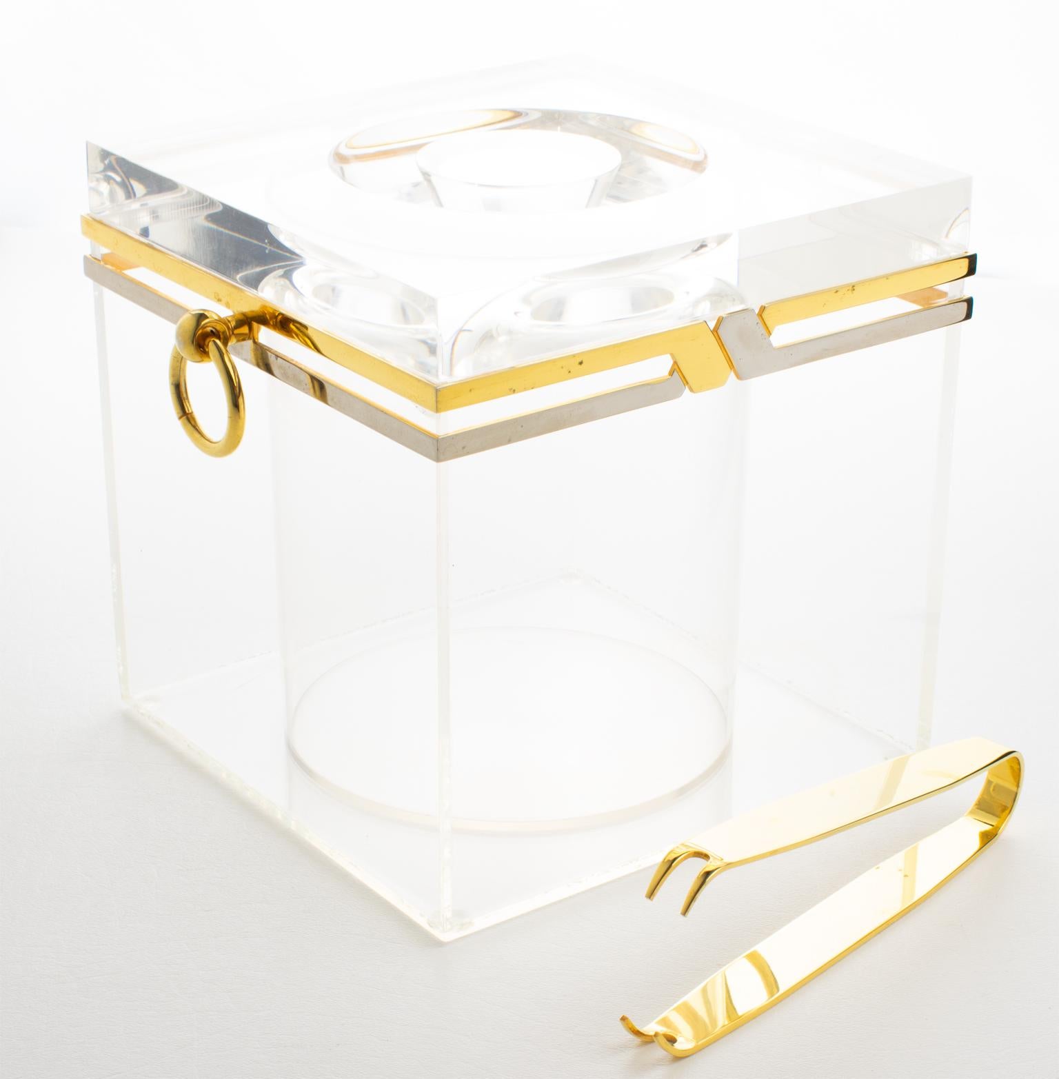 This exceptional bar accessory includes an ice bucket and tongs, perfect for a bar or cocktail party. Its design is attributed to Romeo Rega, Italy, circa 1970. The rare barware tool features chrome and gilded brass metal framing with a crystal
