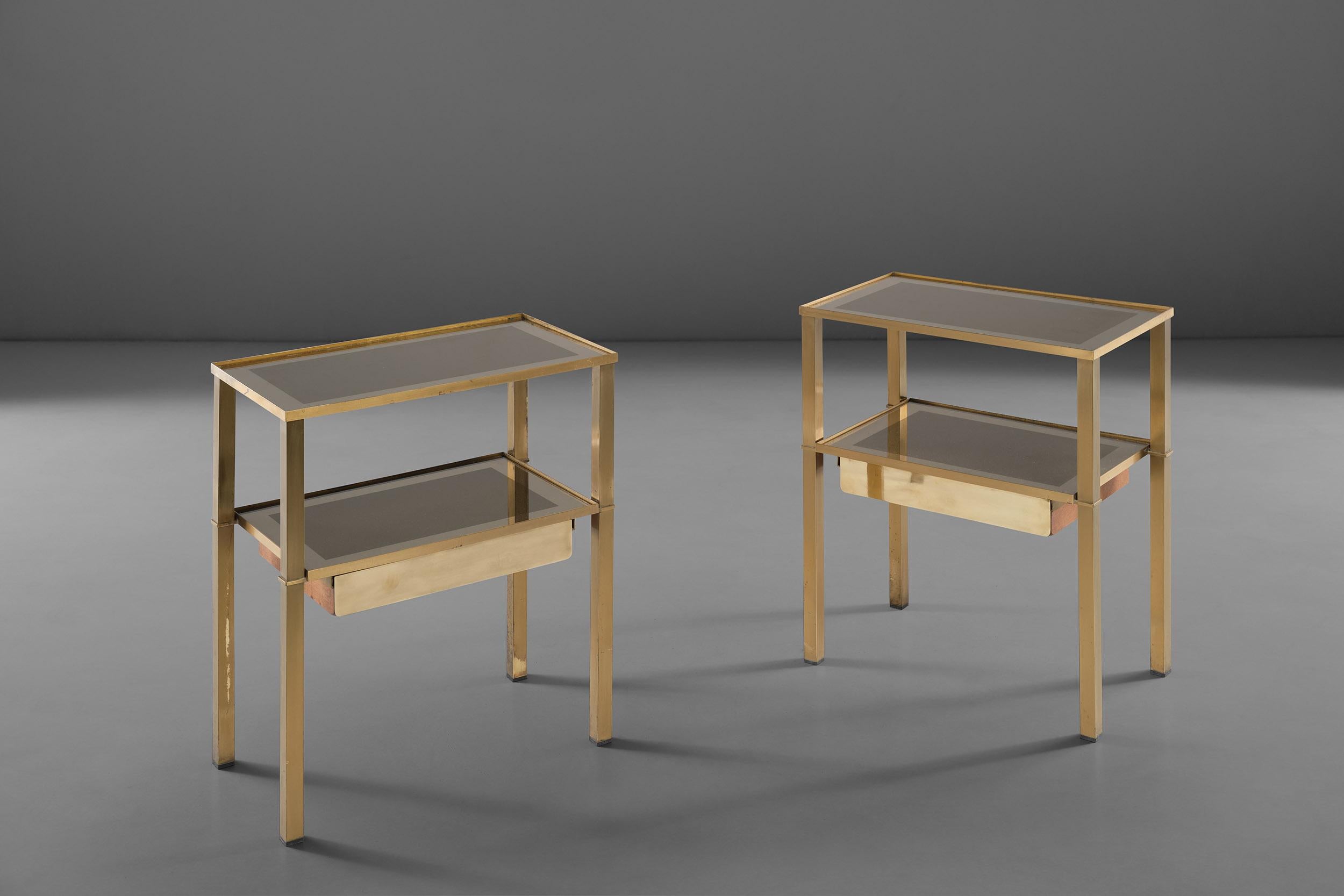 This iconic night table was designed by Romeo Rega in the 70s.
Like most of Rega's production, this clean-lined modernist piece is characterized by a two-level geometric shape, made seductively unique by brass and mirrored glass, which adds the