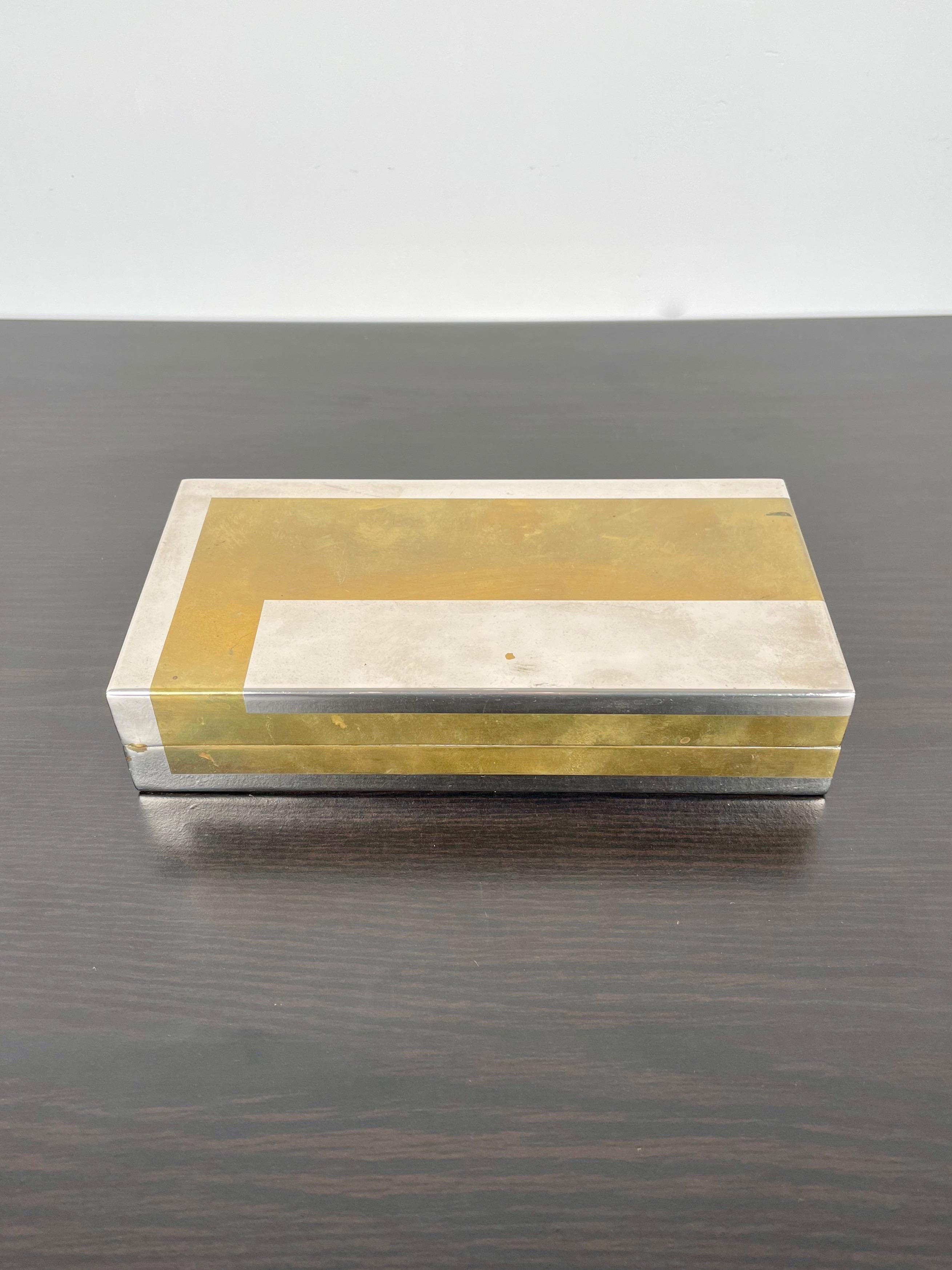 1970s chrome and brass box with black acrylic interior by the Italian designer Romeo Rega. His signature is engraved on the box as shown in photos.