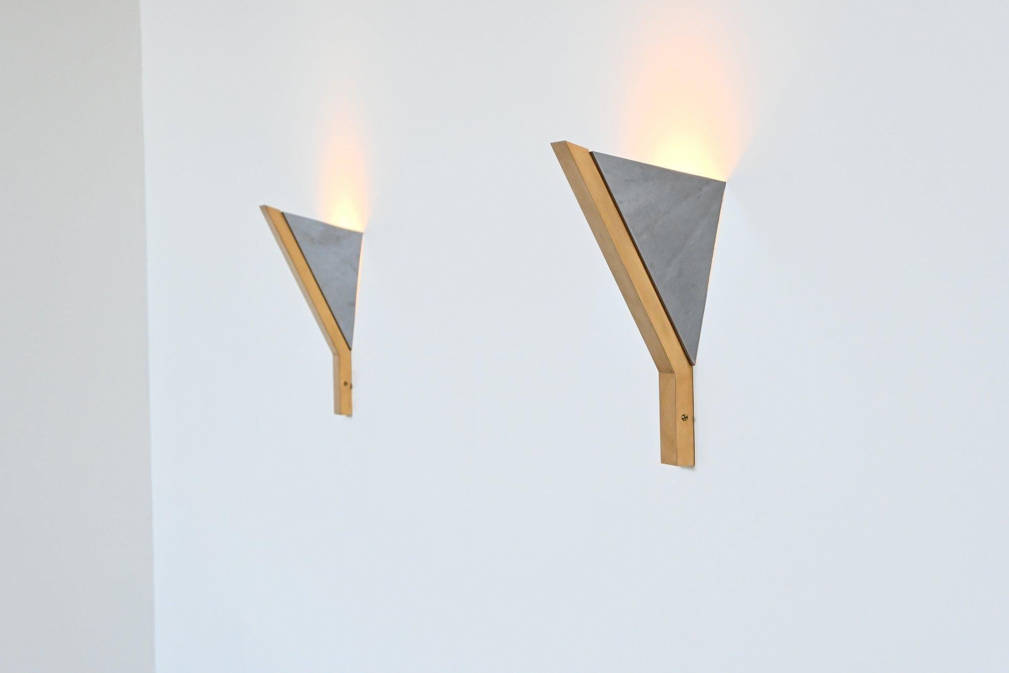Beautiful triangular shaped sconces designed and manufactured by Romeo Rega, Italy 1970. These Hollywood Regency style lamps are made of chromed and brass plated metal. We have eight of them in stock and are all are in very good original condition.