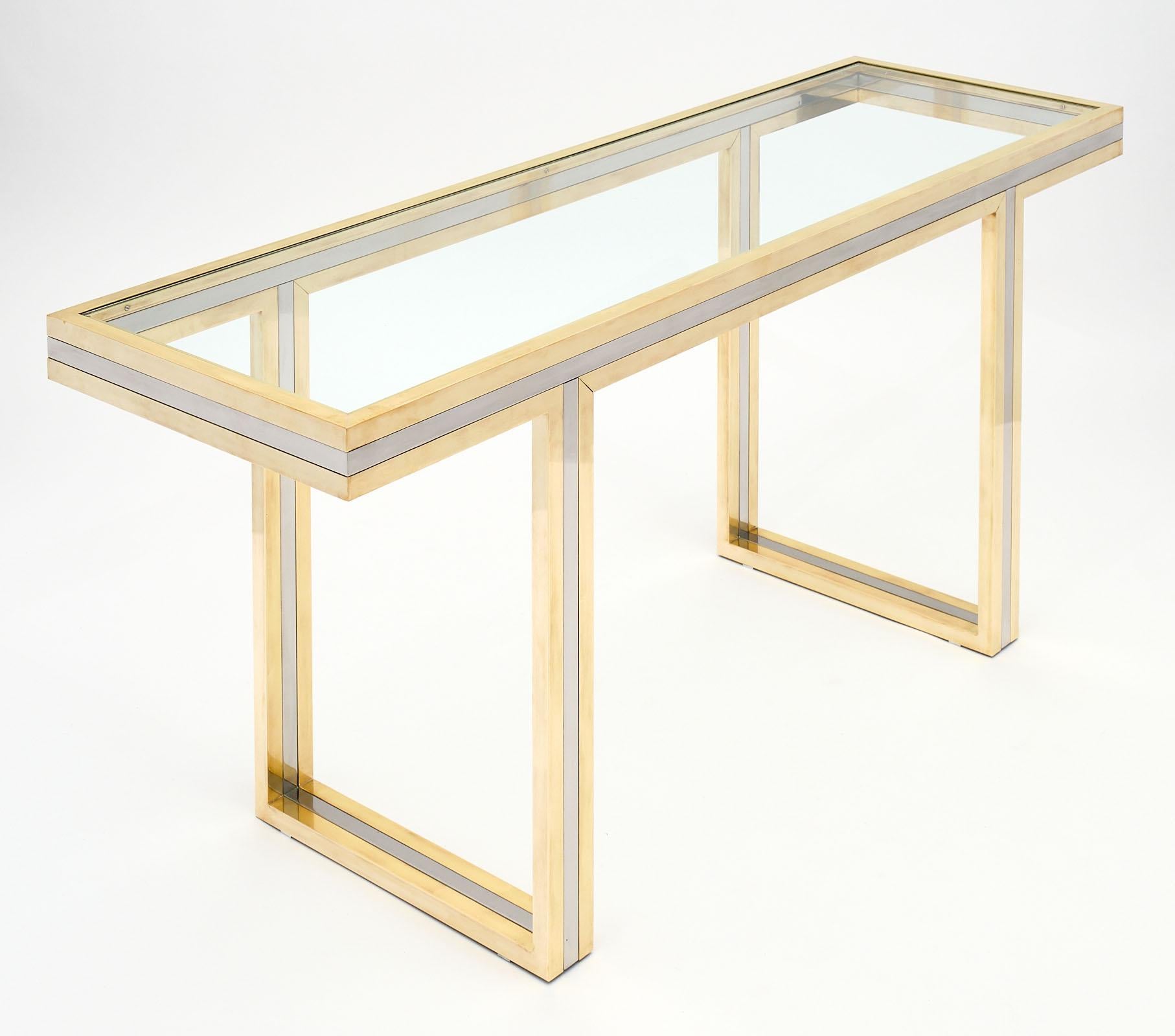 Romeo Rega signed console table made of brass and chromed steel. We love the square sectioned lines and the strong presence of this piece. This Italian console is signed by the iconic designer Romeo Rega.