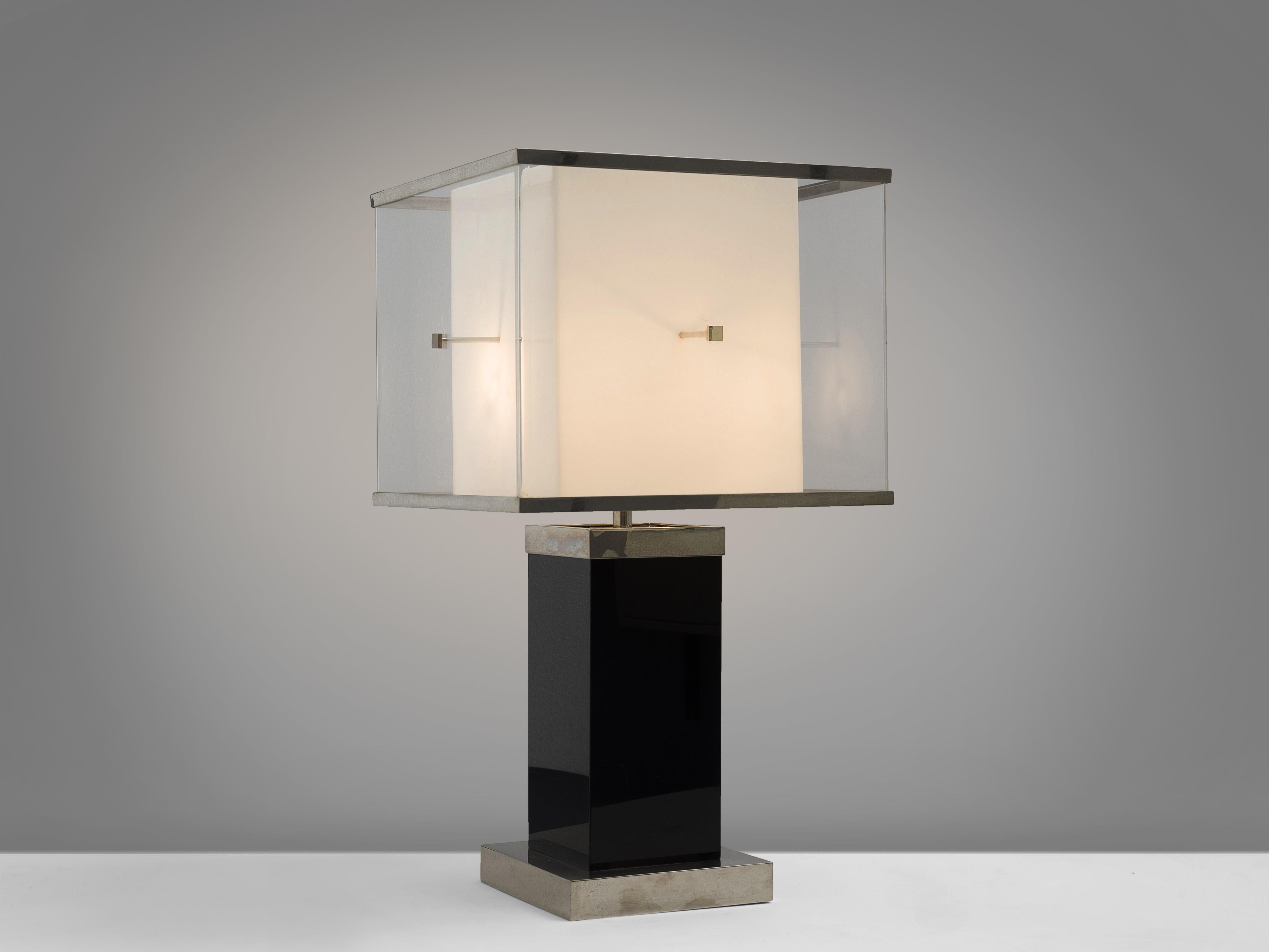 Attributed to Romeo Rega, table lamp, Lucite, Italy, 1970s.

This cubical table lamp features a small white base on which a deep black foot rests. On top of the black and white base stands a large shade. The design is typical for postwar,