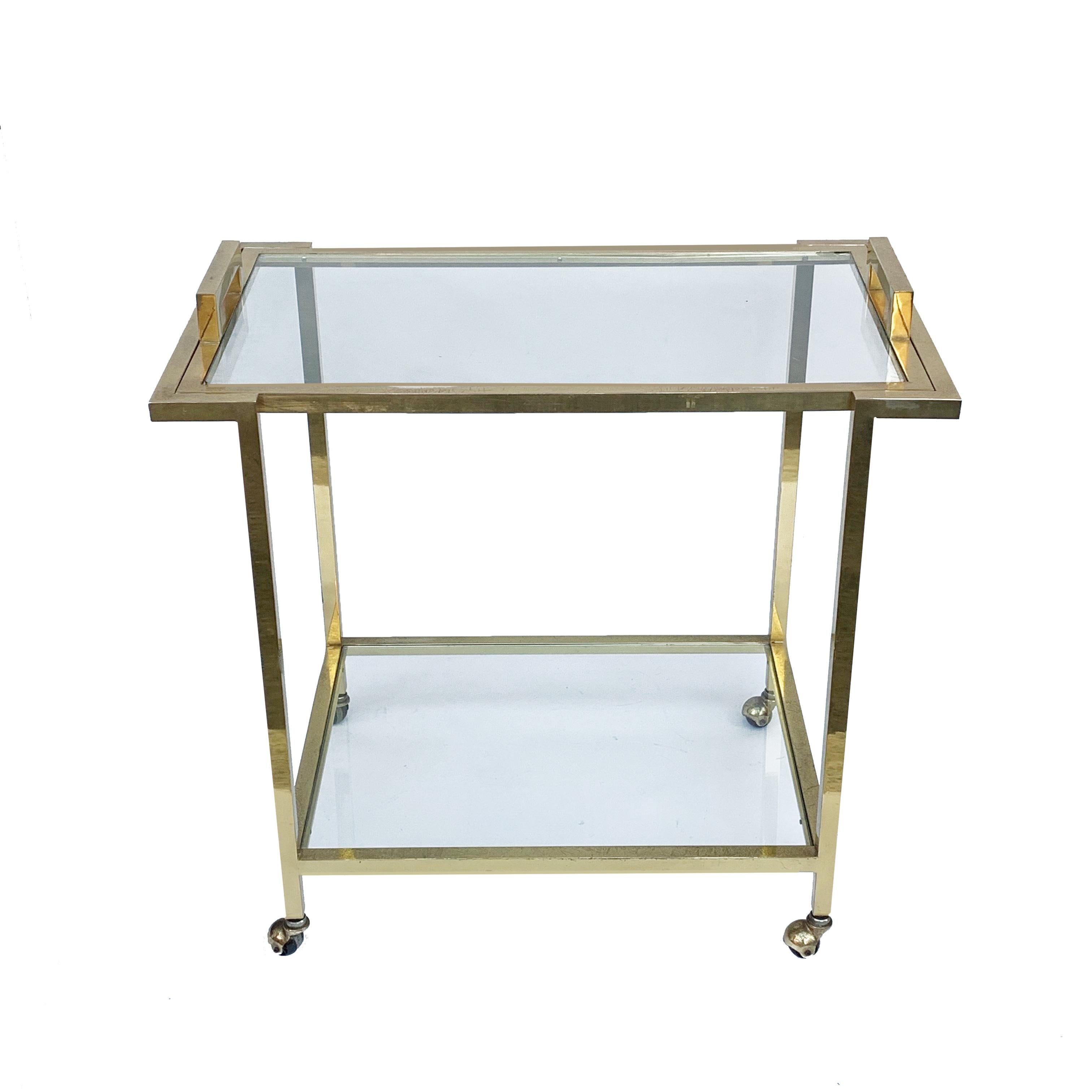 Elegant trolley with service tray in gilded brass and glass. Two levels. Attributed to Romeo Rega, Italy, 1980s.