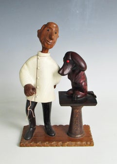Romer Italy hand carved desk top veterinarian with puppy patient sculpture