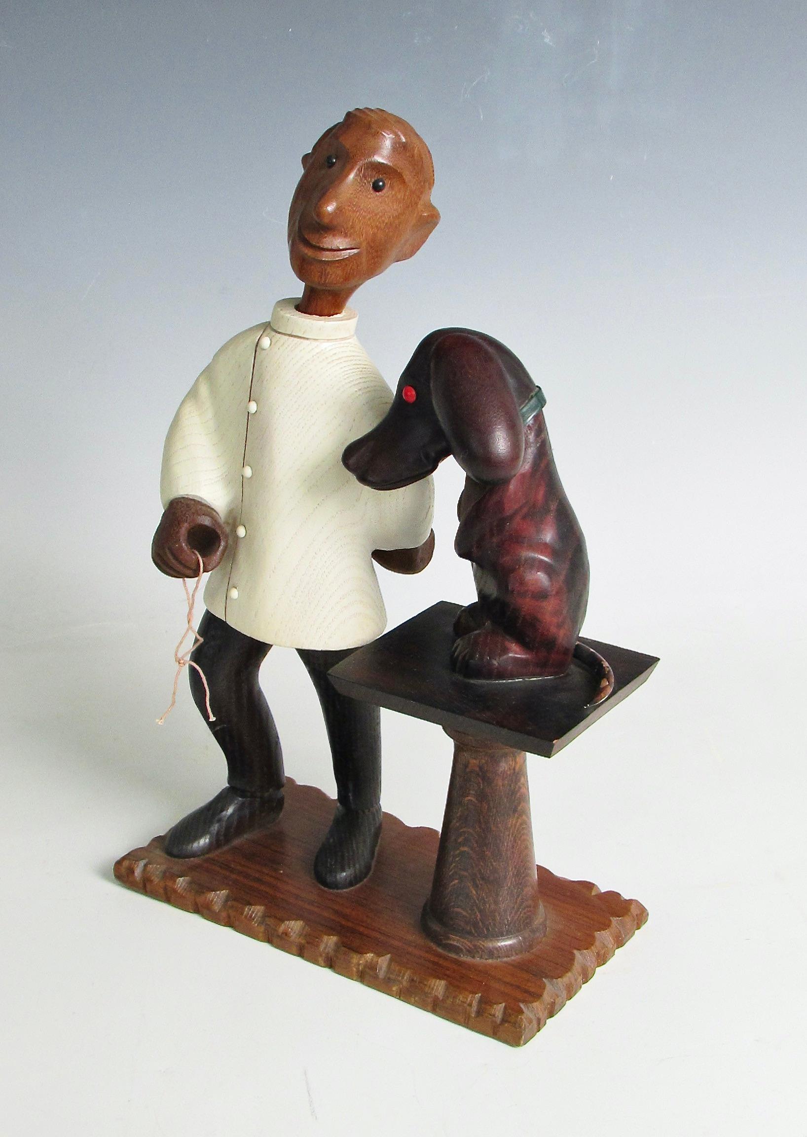 Mid-Century Modern Romer Italie, sculptée à la main, sculpture d'un vétérinaire avec un patient chiot en vente
