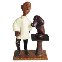 Romer Italy hand carved desk top veterinarian with puppy patient sculpture