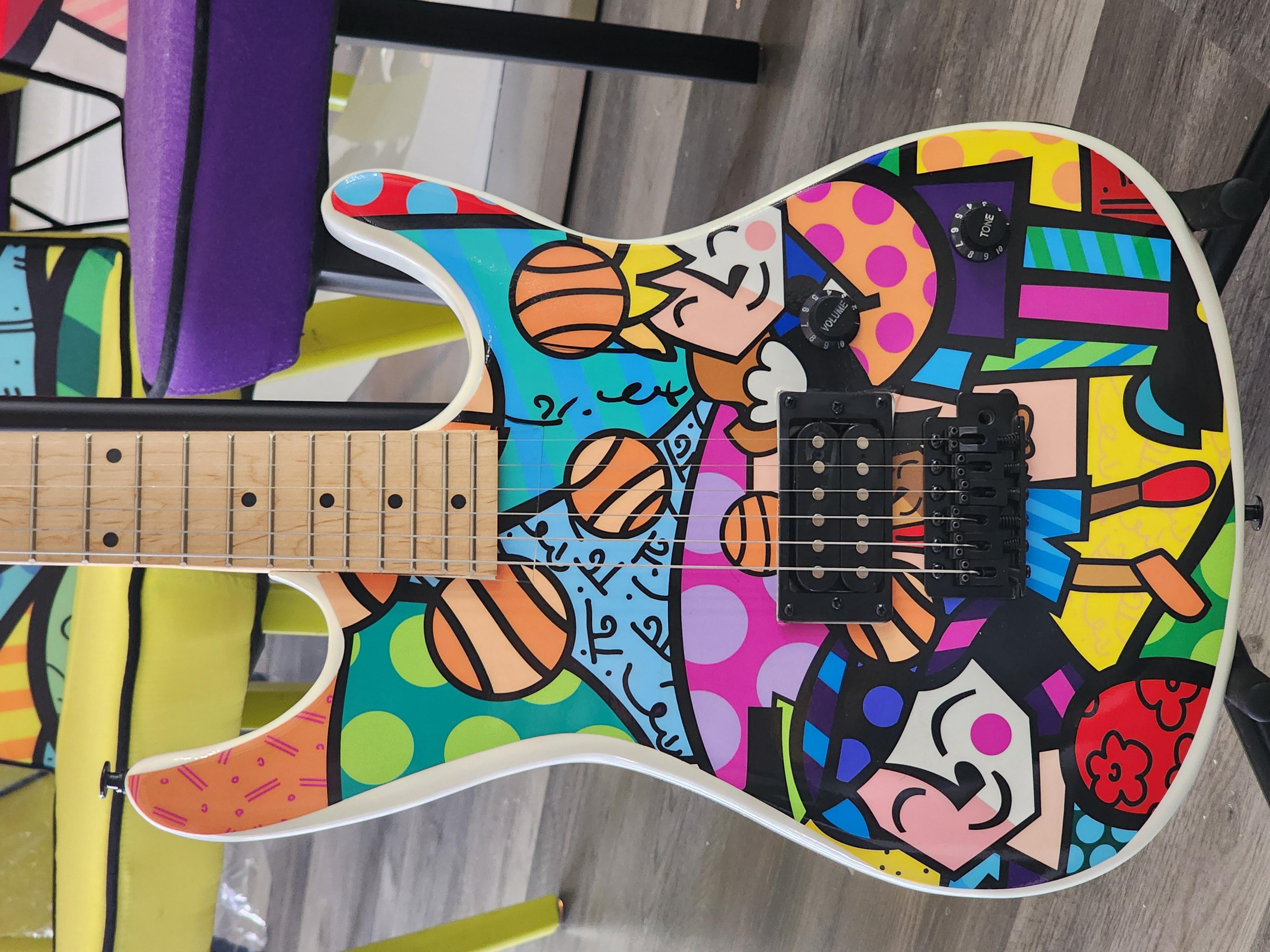 Artist: Romero Britto
Signed one of a kind, 'Viper' electric guitar by BGuitars. The guitar helped to raise 1M dollars for Lauren's kids foundation - An organization that educates adults and children to prevent sexual abuse and heal survivors.