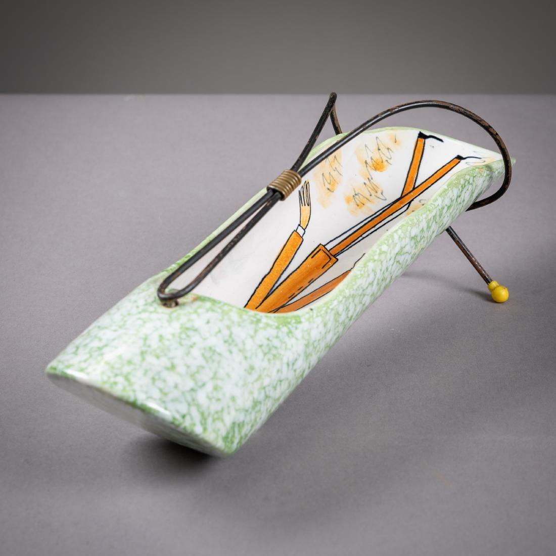 Rometti Italy midcentury porcelain breadstick holster server platter. Hand painted figurative scene in orange and cream inside, green marbled exterior, swooping metal handle with yellow dot feet. Scale of figures and handle relative to central