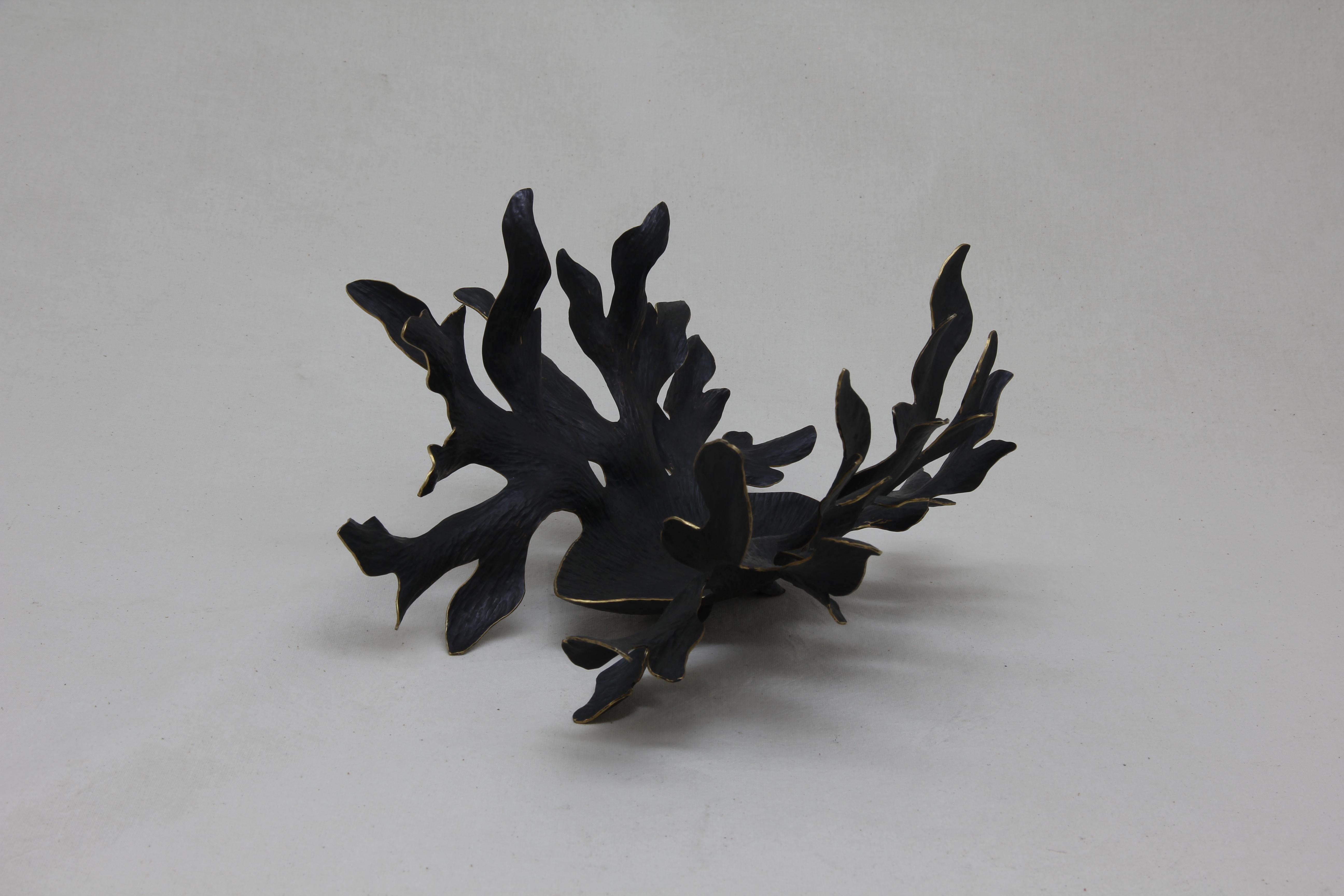 Inspired by the wonderful shapes of the majestic Elk antlers, this organic centerpiece is made out of oxidized Tumbaga.
100% hand made by expert craftsmen, each sheet of metal is hand hammered, cut and twisted using metal and wood as a last to give
