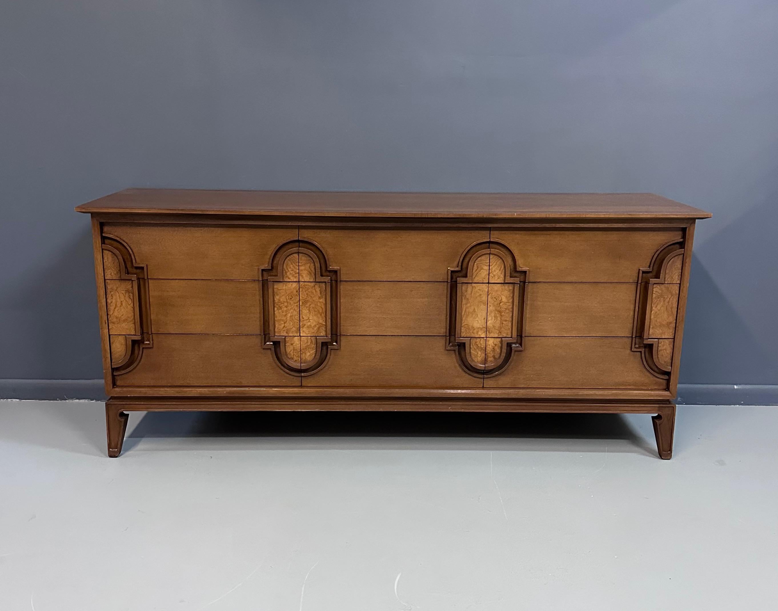 Romweber substantial nine drawer dresser in fruitwood with lovely burl accents. This dresser has generous drawers with a tray in a top drawer for your accoutrement.