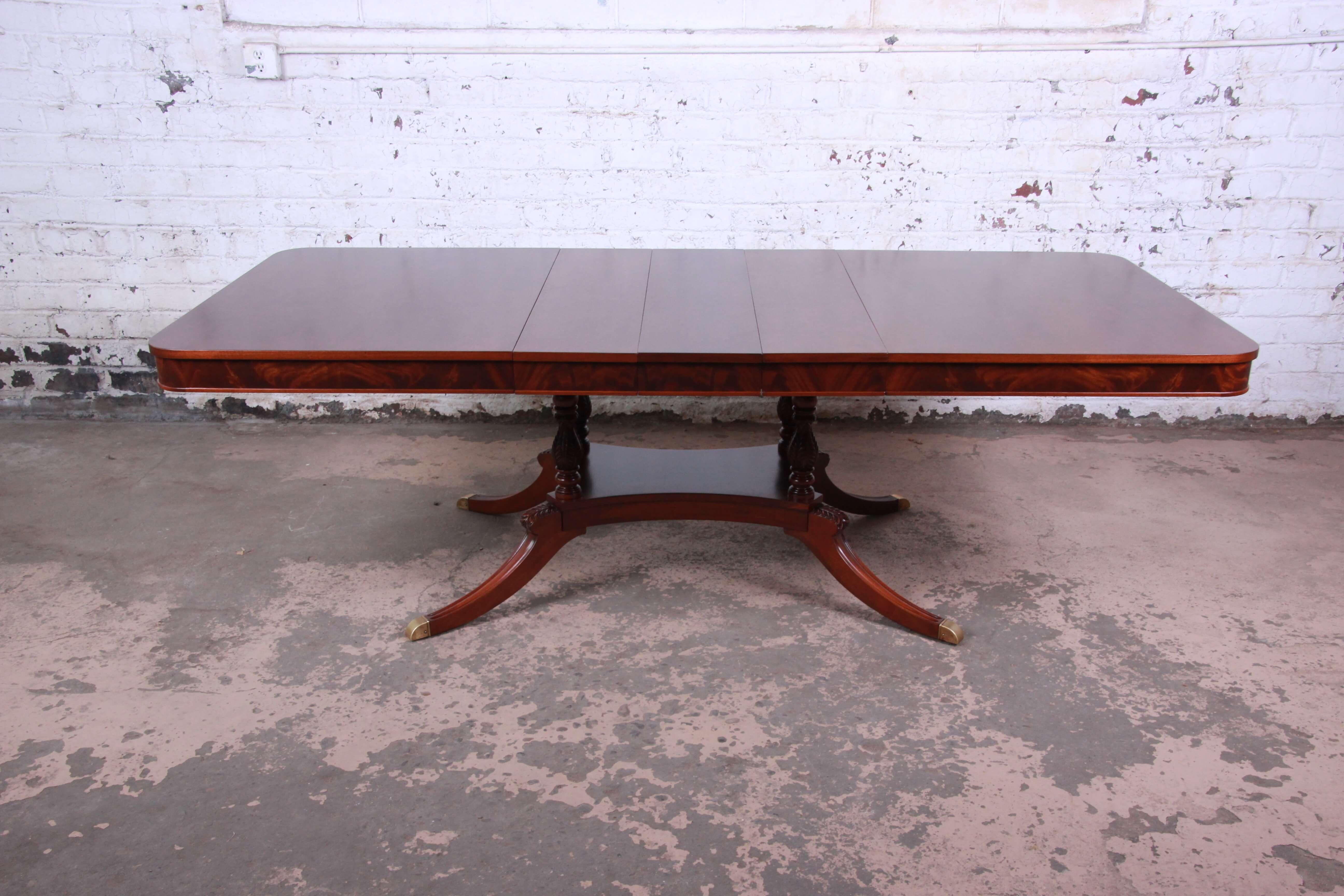 Offering a stunning and elegant custom Romweber mahogany extension dining table. The table extends to 95.28