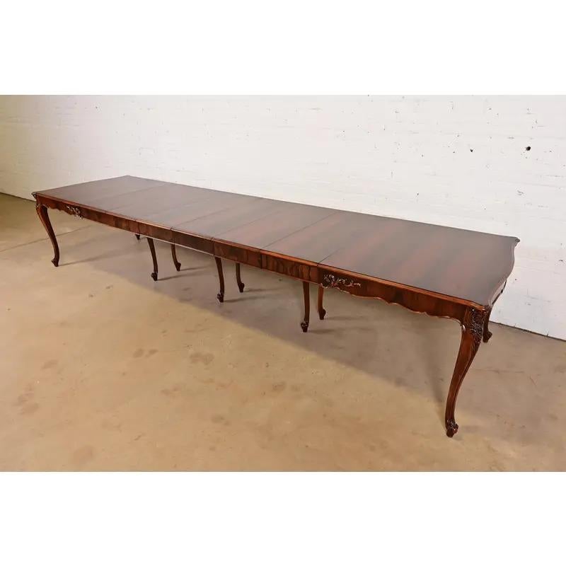 An exceptional French Provincial Louis XV style extension dining table

By Romweber

USA, Circa 1920s

Stunning book-matched rosewood top, with carved cabriole legs. 

Measures: 65.75