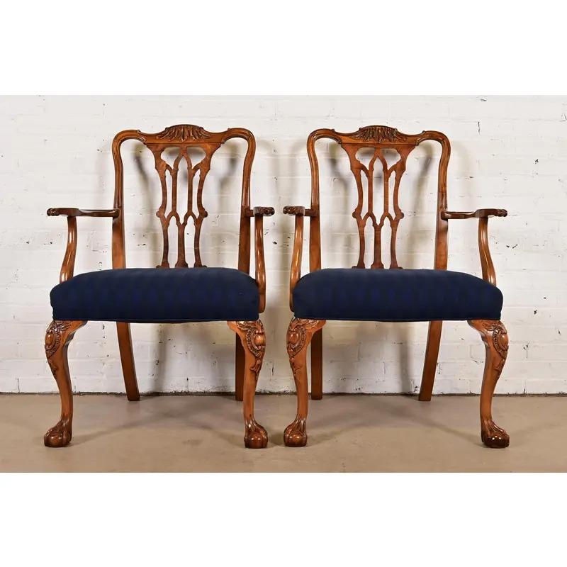 An outstanding pair of Chippendale or Georgian style armchairs or dining captain chairs

By Romweber

USA, Circa 1920s

Carved walnut and burl wood frames, with ball and claw feet, and upholstered seats.

Measures: 27