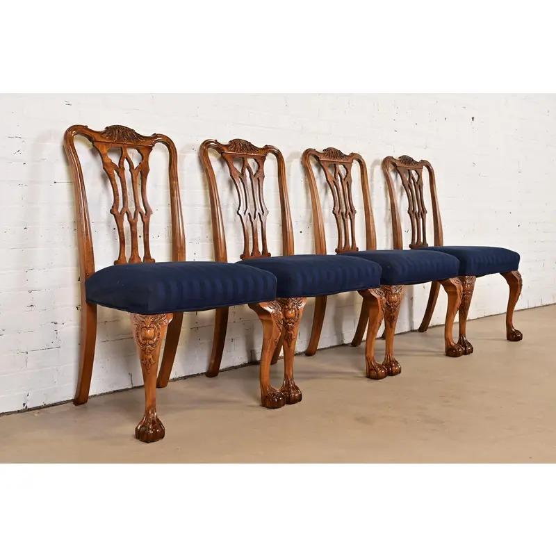 An outstanding set of four Chippendale or Georgian style dining chairs

By Romweber

USA, Circa 1920s

Carved walnut and burl wood frames, with ball and claw feet, and upholstered seats.

Measures: 23.25