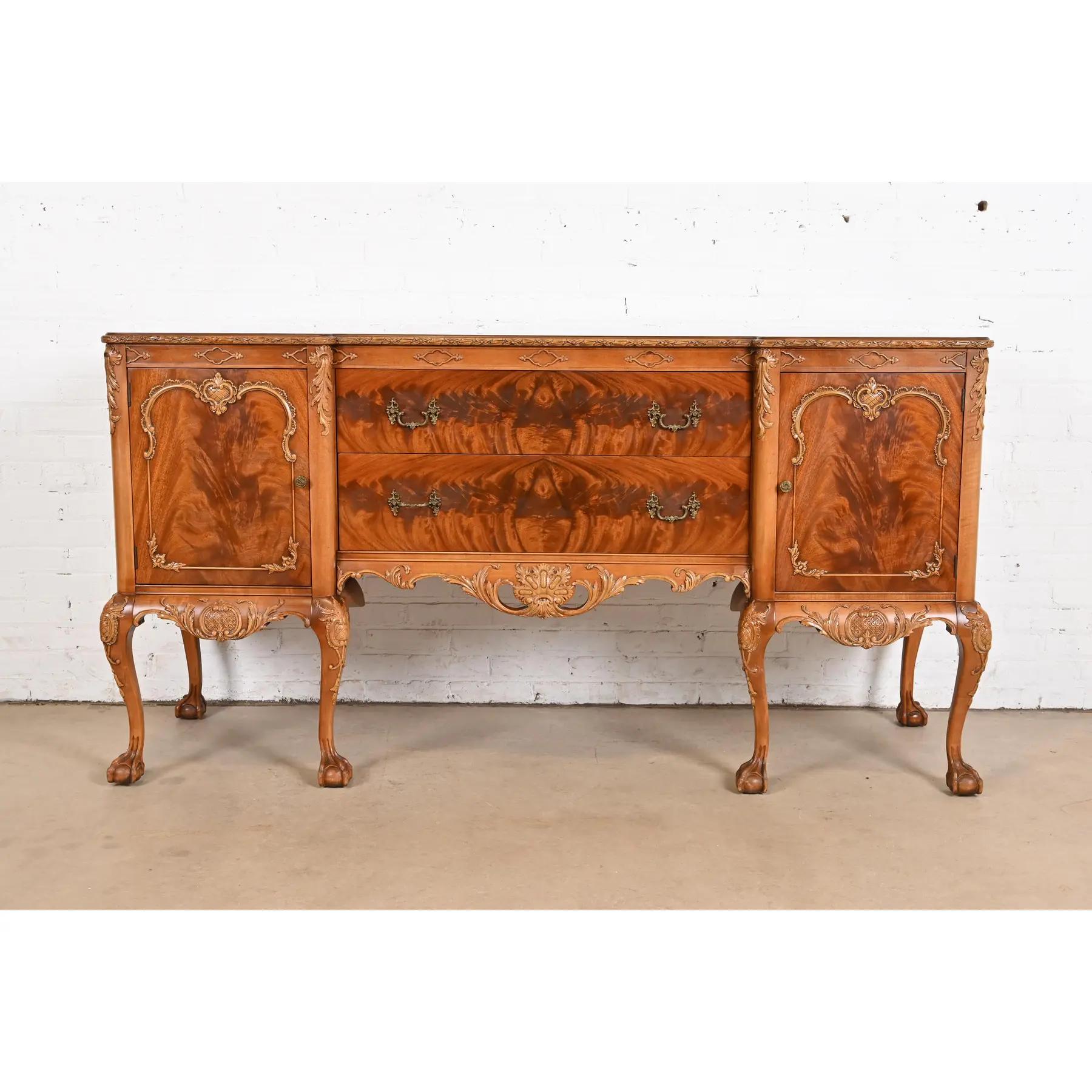 An exceptional Chippendale or Georgian style ornate carved sideboard buffet or credenza

By Romweber

USA, Circa 1920s

Gorgeous book-matched flame mahogany, with carved cabriole legs, ball and claw feet, and original brass hardware.

Measures: 73