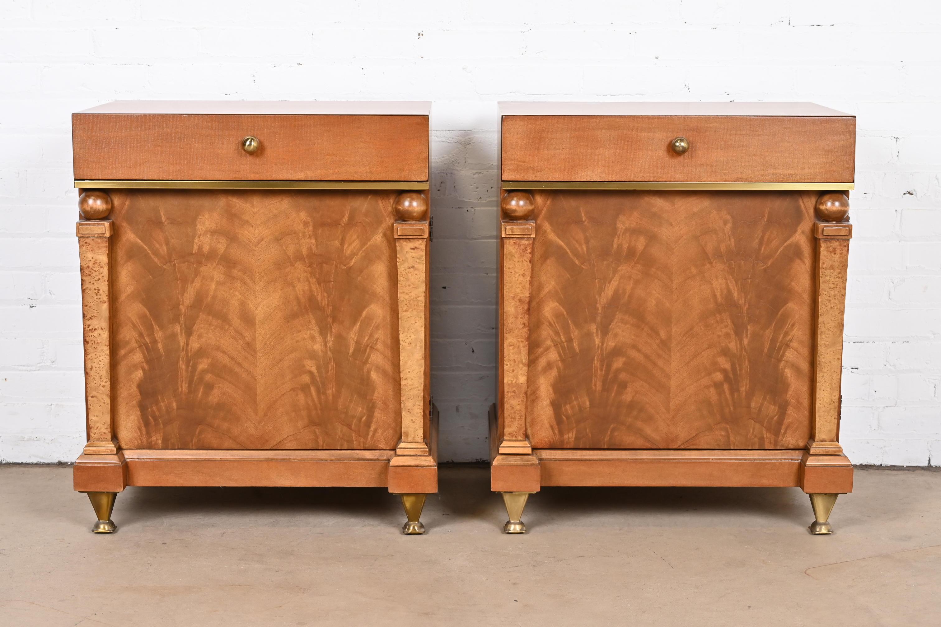 An exceptional pair of Empire or Neoclassical style nightstands

By Romweber

USA, circa 1940s

Mahogany cases, with gorgeous book-matched flame mahogany fronts, burl wood columns, and original brass hardware and feet.

Measures: 24