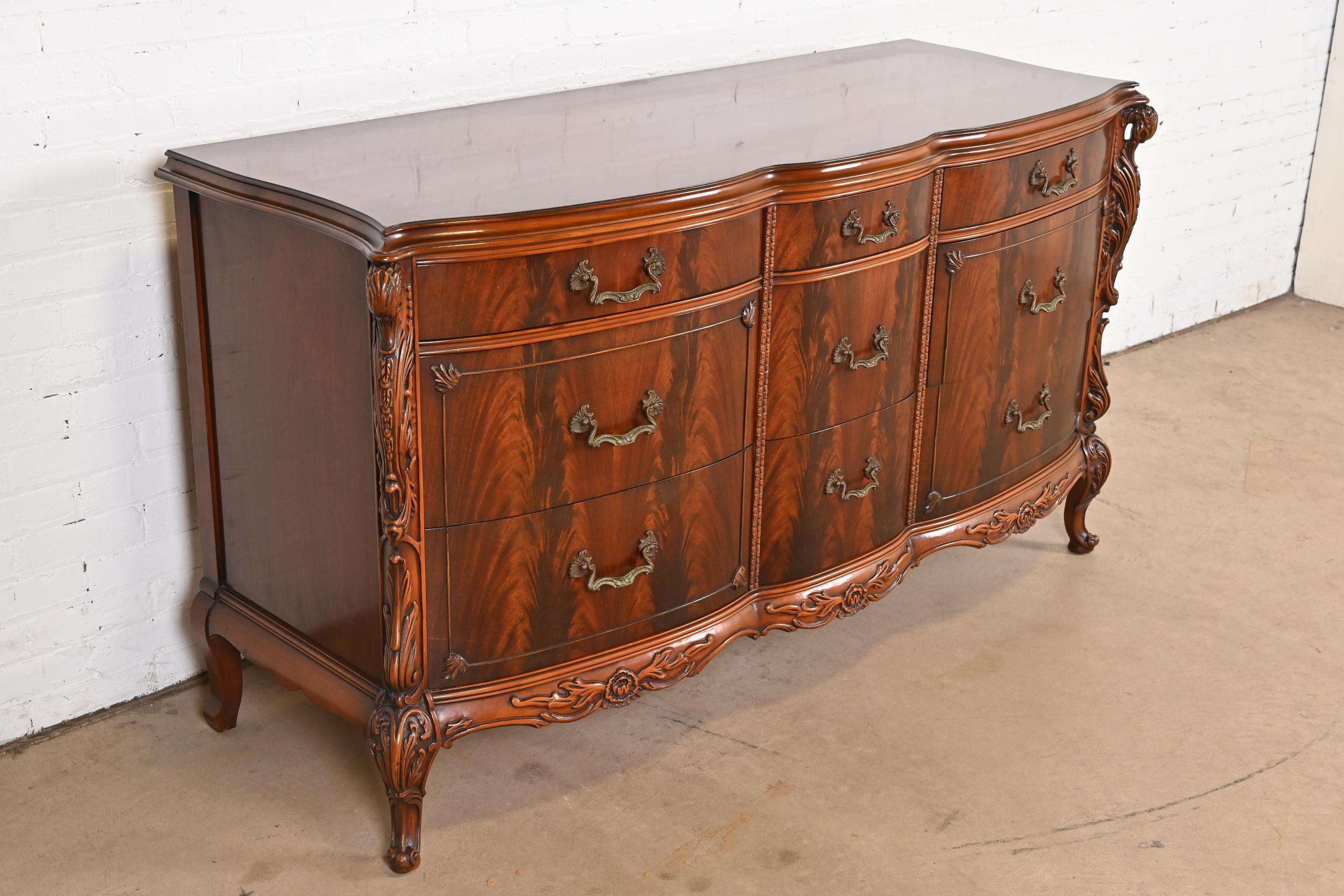 Brass Romweber French Louis XV Flame Mahogany Dresser With Carved Swan Heads, 1930s For Sale