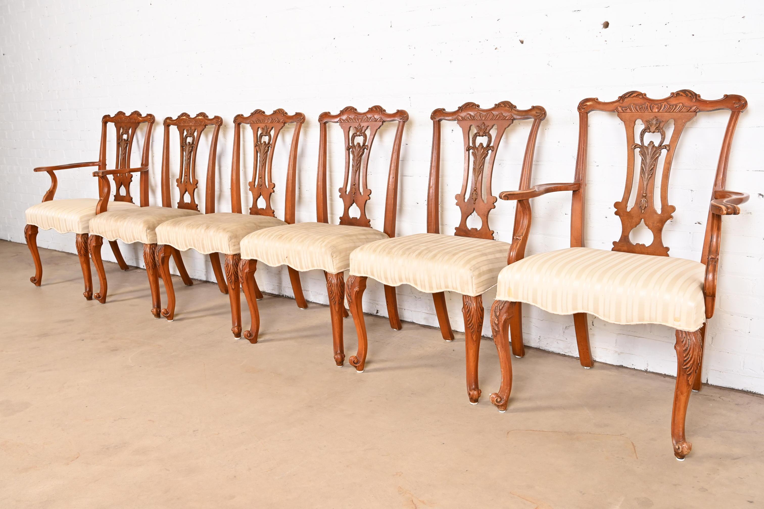 A stylish set of six French Provincial Louis XV style dining chairs

By Romweber

USA, Circa 1920s

Beautiful carved exotic burled acacia wood, with upholstered seats.

Measures:
Side chairs - 22.5