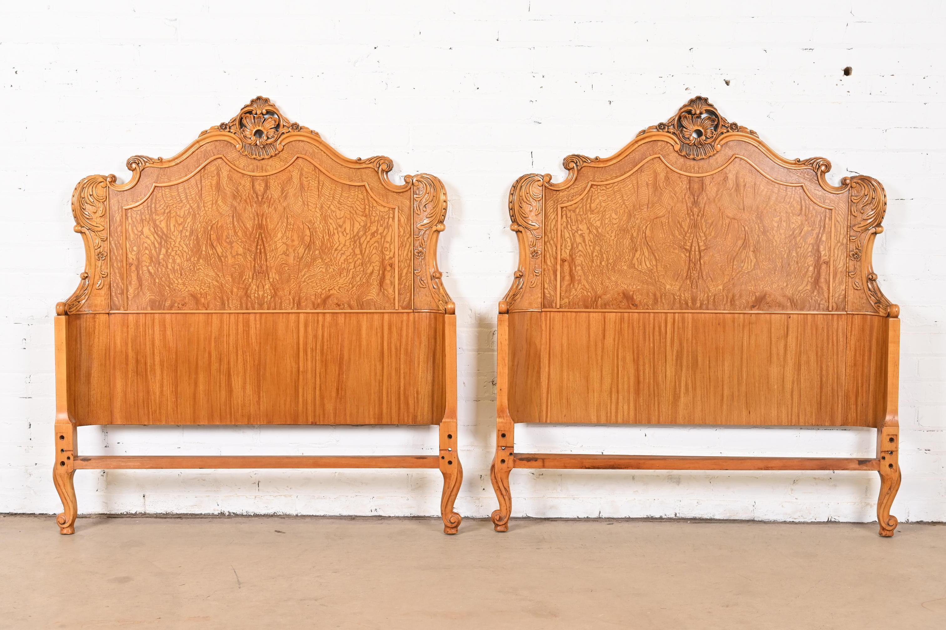 A gorgeous pair of French Provincial Louis XV style twin size headboards

By Romweber

USA, Circa 1920s

Stunning book-matched exotic burled Narra wood, with floral carvings and cabriole legs.

Measures: 43