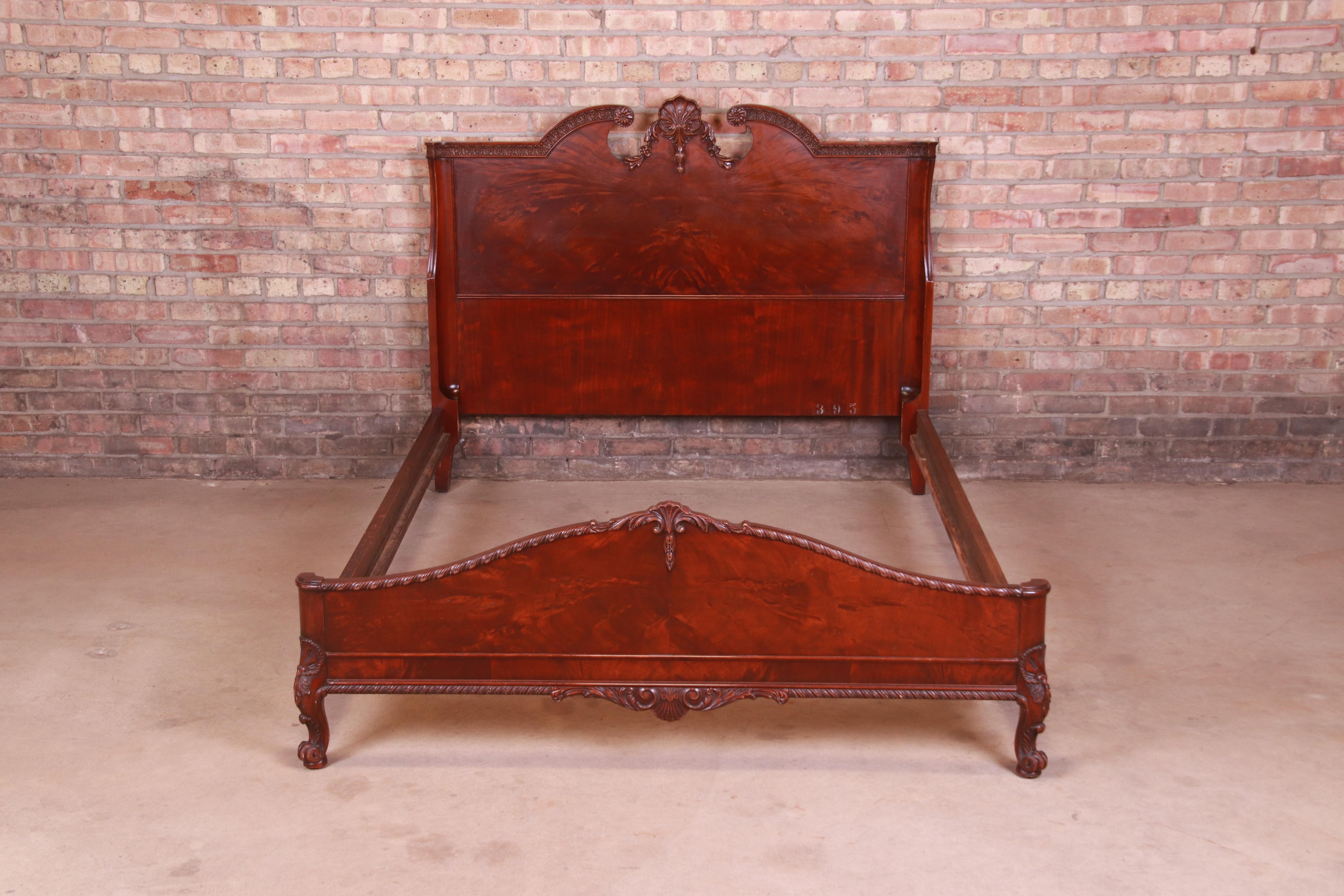 A gorgeous French Provincial Louis XV style full size bed frame

By Romweber

USA, Circa 1920s

Burled mahogany, with ornate carved details.

Measures: 57