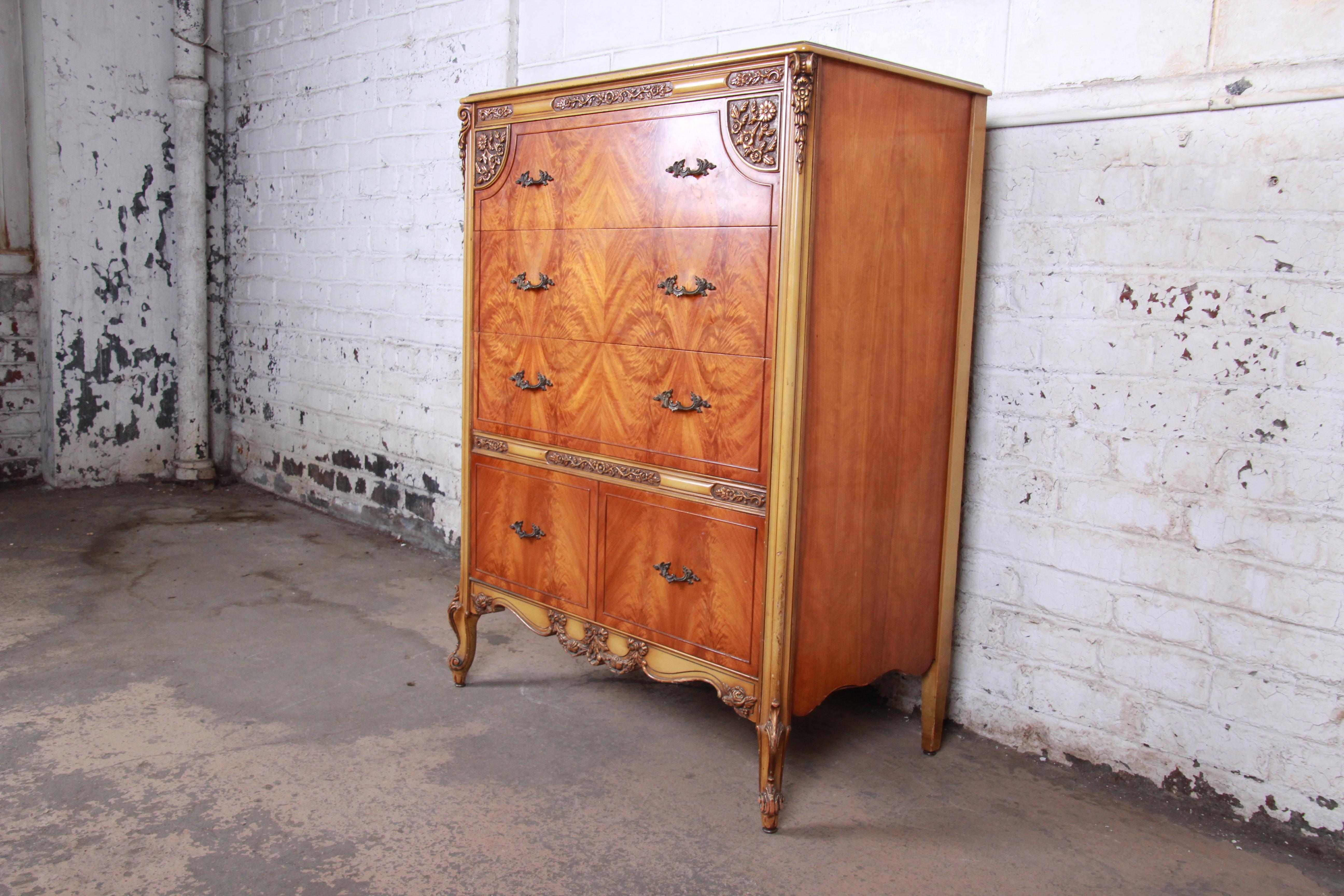A gorgeous French Provincial Louis XV style highboy dresser

Attributed to Romweber Furniture

USA, circa 1930s

Bookmatched flame mahogany and solid oak interior and original brass hardware

Measures: 38.5