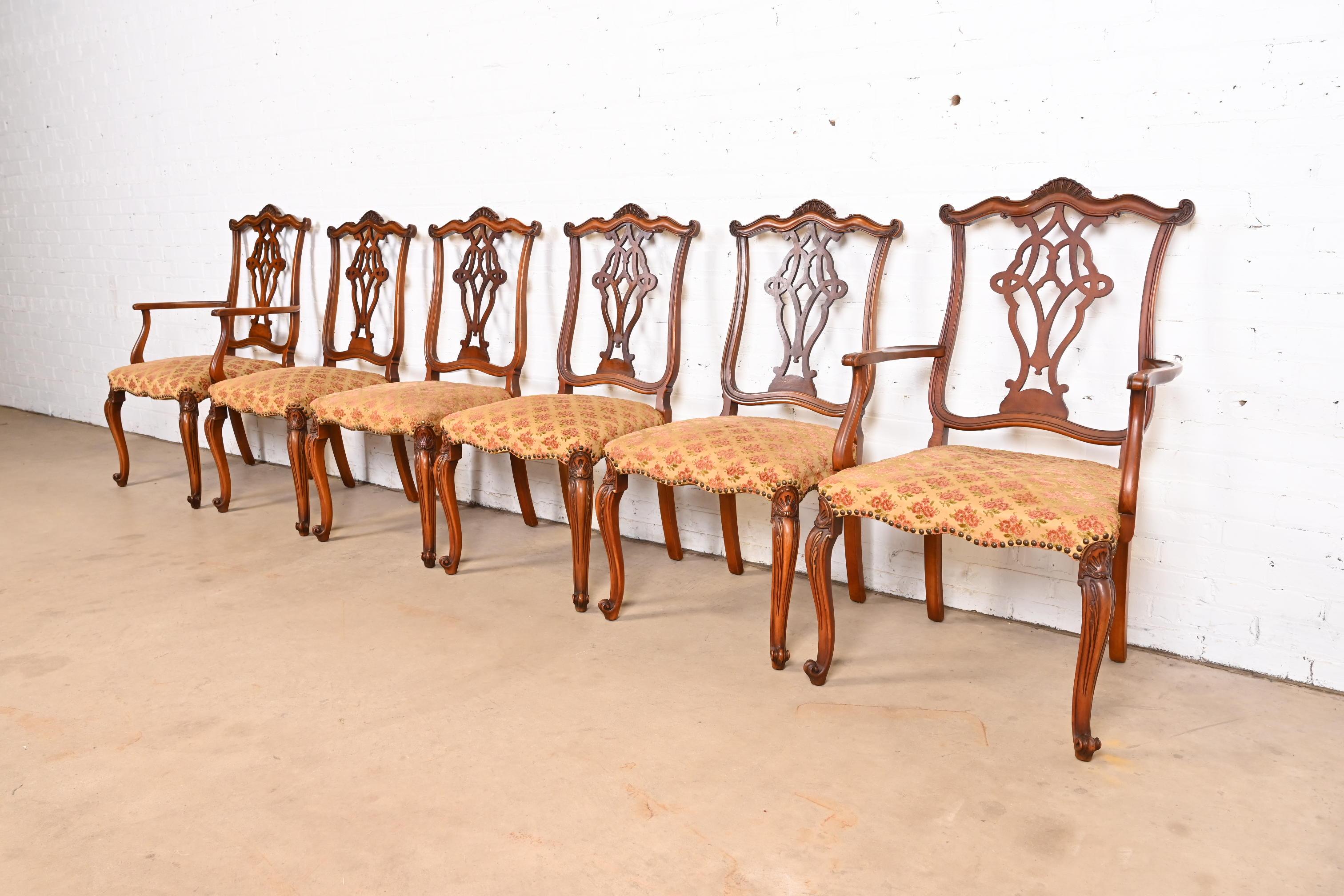 A stylish set of six French Provincial Louis XV style dining chairs

By Romweber

USA, Circa 1920s

Beautiful carved exotic burled acacia wood frames, with upholstered seats.

Measures: 
Side chairs - 21.75