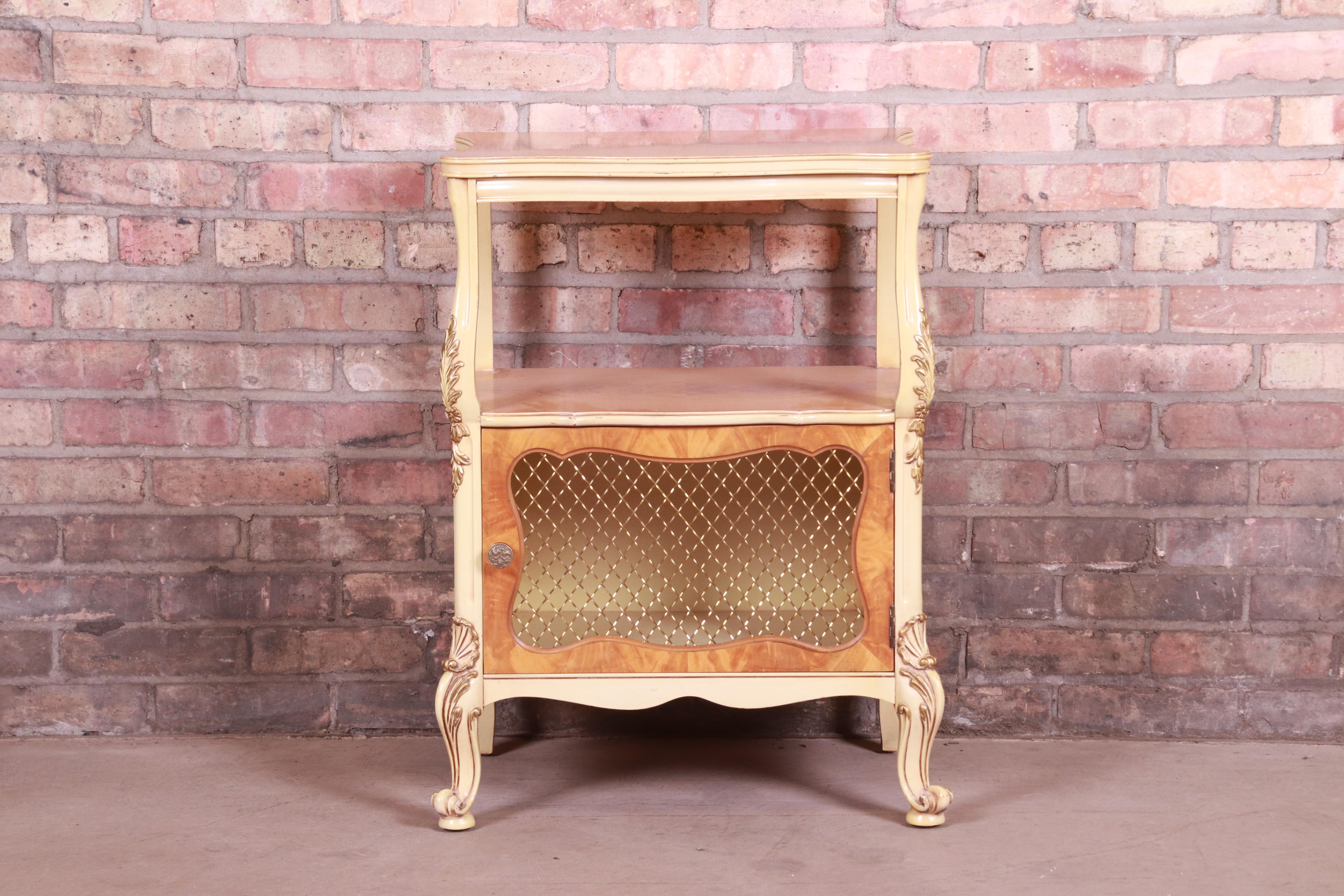 A gorgeous French Rococo Louis XV style nightstand or occasional side table

By Romweber

USA, Circa 1930s

Exotic burled African avodire wood, with paint and gilt details and original brass hardware.

Measures: 20.5