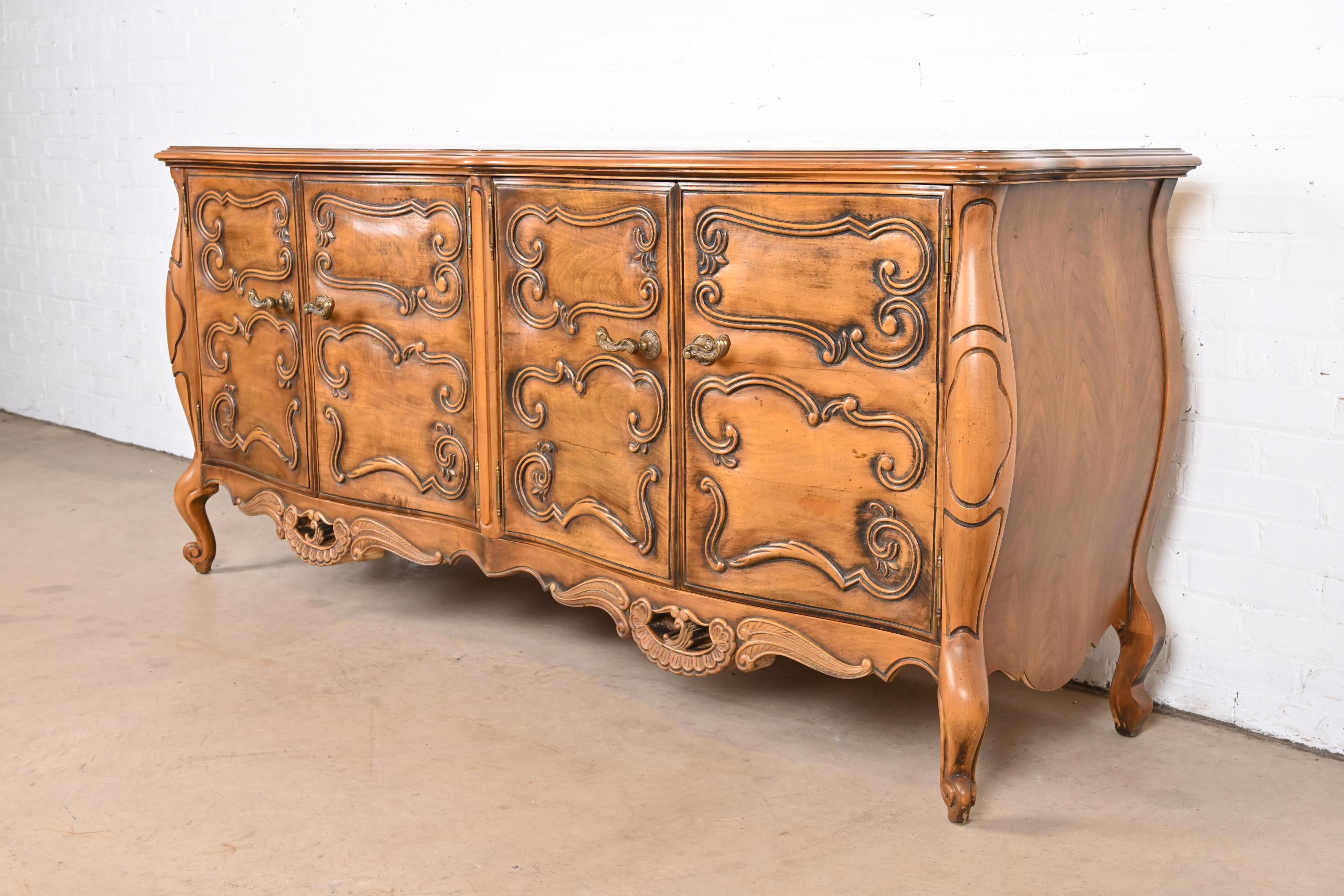 A gorgeous French Rococo Louis XV style sideboard, credenza, or bar cabinet

By Romweber

USA, circa 1960s

Carved walnut, with original brass hardware.

Measures: 78.5