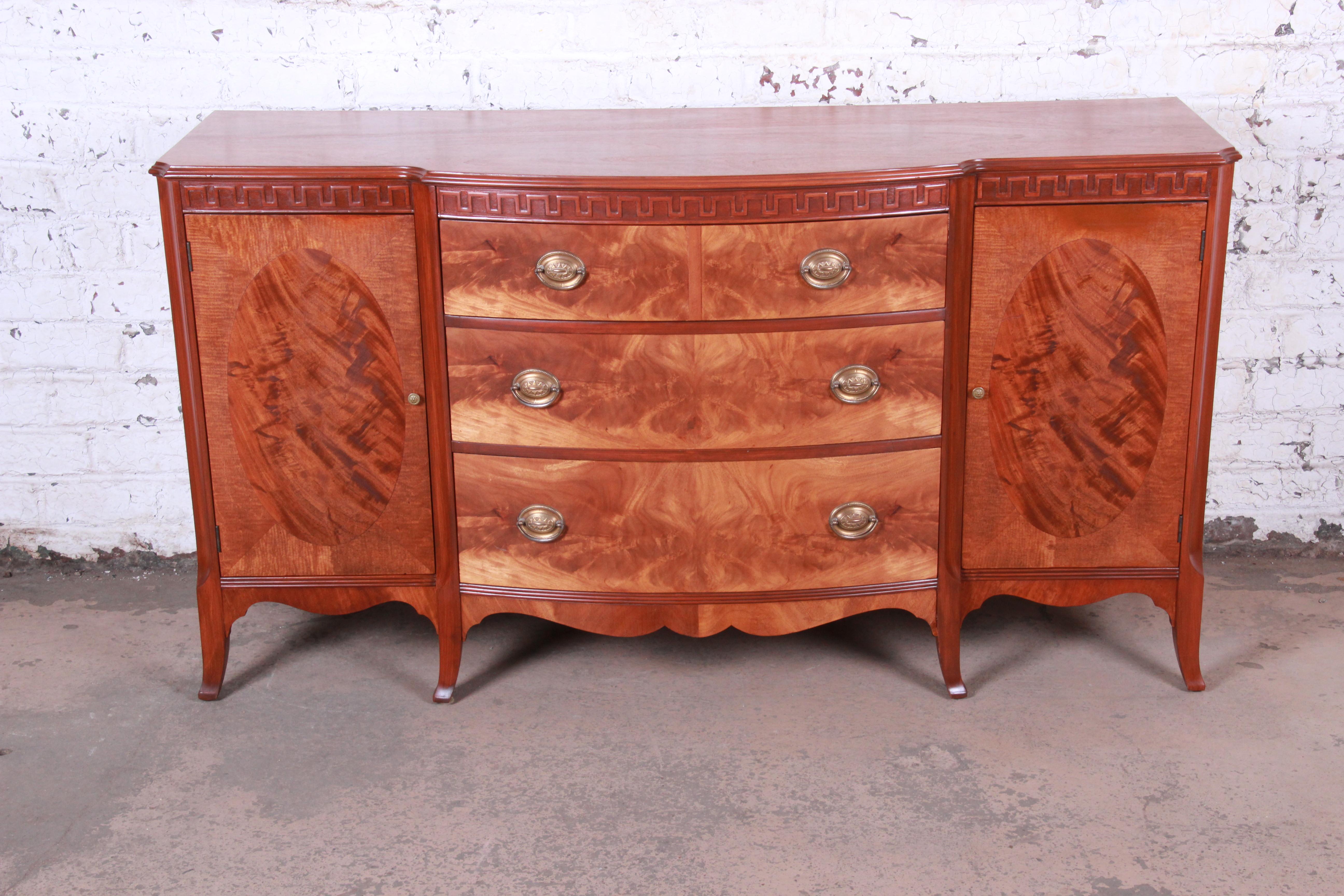 An exceptional newly restored vintage sideboard credenza or bar cabinet

By Romweber

USA, circa 1940s

Book-matched flame mahogany and burl and brass hardware

Measures: 66