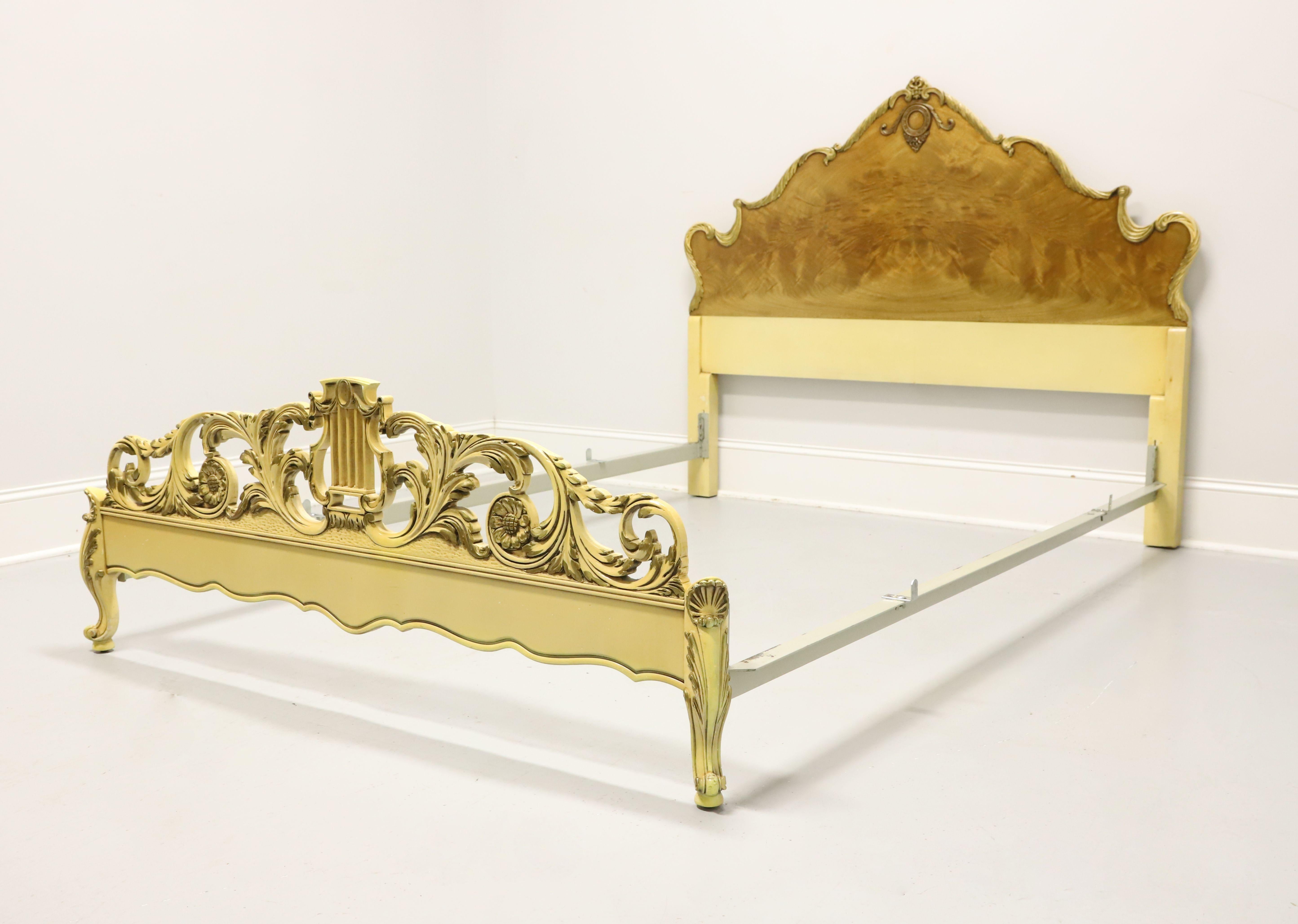 A French Provincial style queen size bed by Romweber Furniture, from their Marquise Collection. Solid wood painted an antique white with satinwood to the headboard, decoratively carved headboard & footboard with scrollwork, and clip held metal side