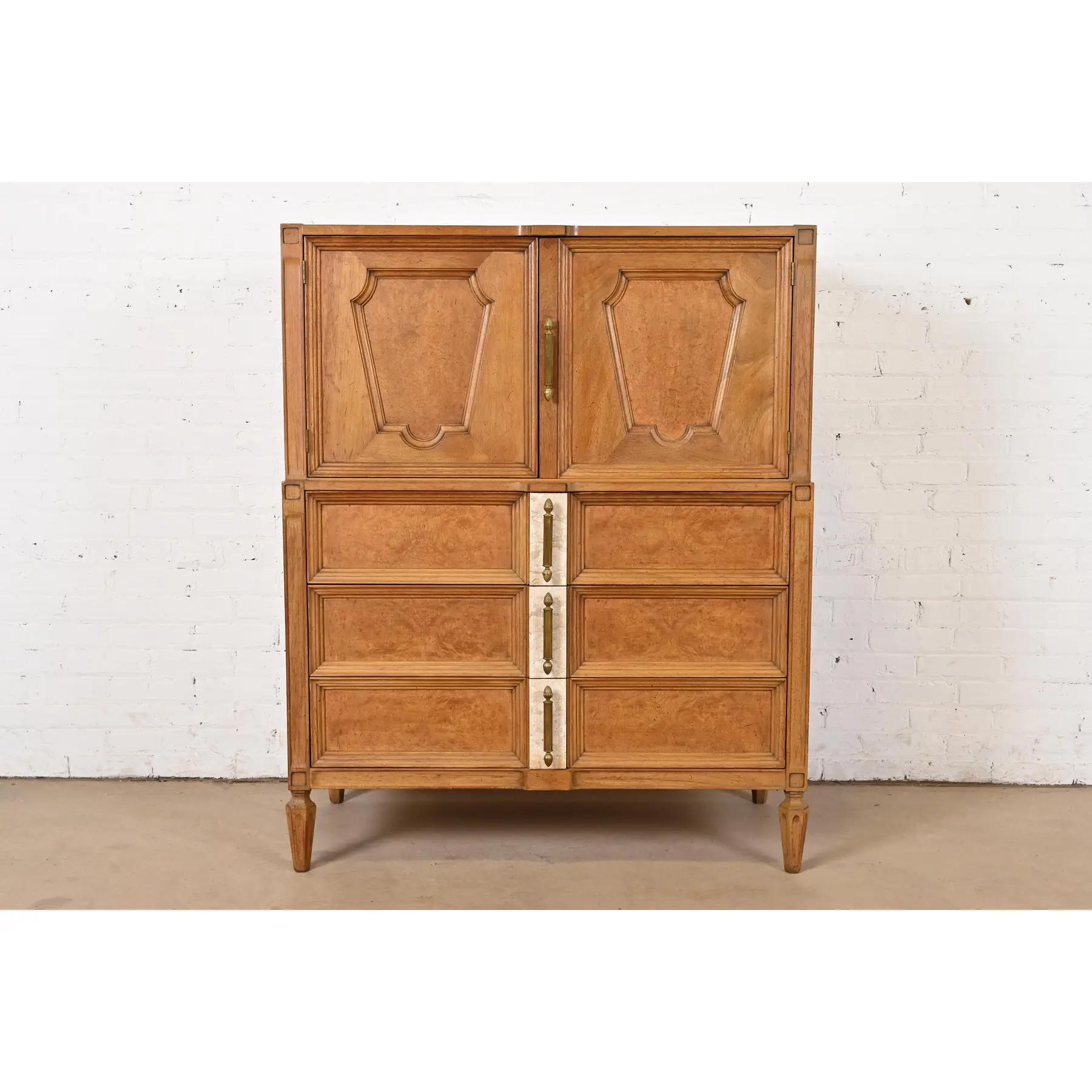 A gorgeous Mid-Century Modern Hollywood Regency gentleman's chest

By Romweber

USA, Circa 1960s

Cherry wood case, with burl wood banding and front, and unique Italian travertine and brass hardware.

Measures: 42