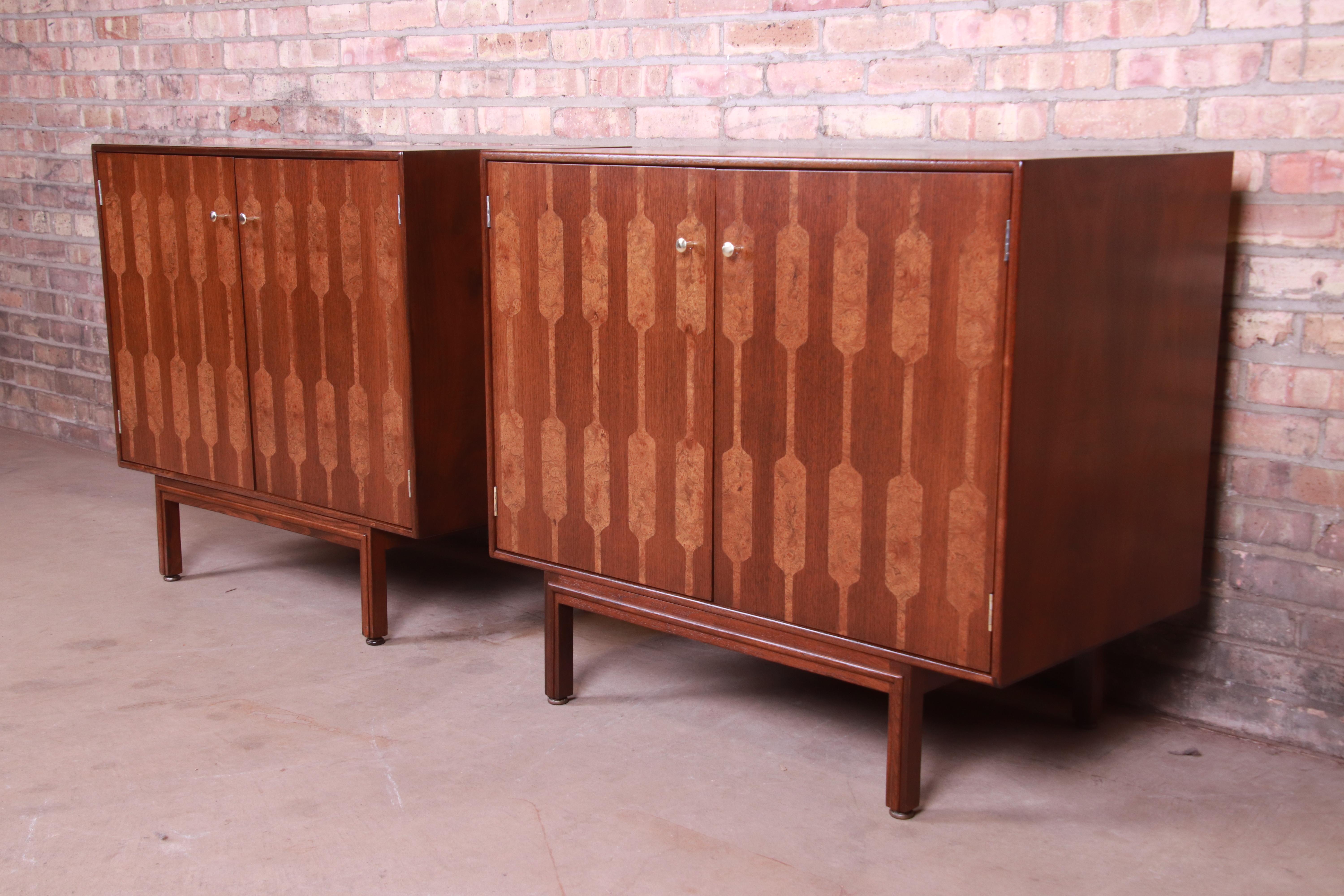 An exceptional pair of Mid-Century Modern cabinets or large bedside chests

By Romweber

USA, 1950s

Walnut, with inlaid olive ash burl wood and original brass hardware.

Measures: 35.5