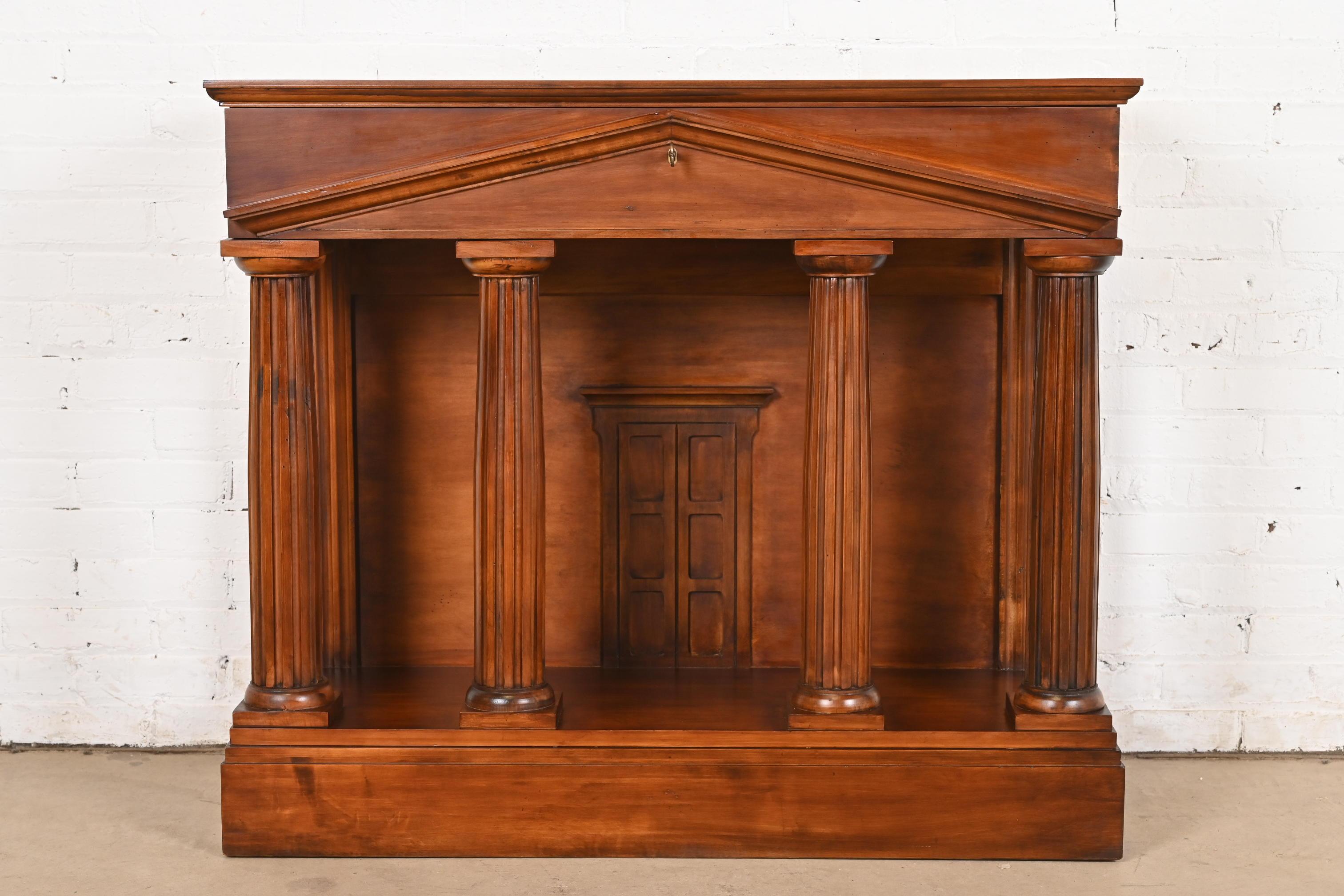 A rare and unique classical Greek or Roman style sideboard or console table

By Jim Peed for Romweber

USA, Late 20th Century

Carved walnut in unique Roman Pantheon form, with gorgeous book-matched burled walnut top. Drawer locks, and key is