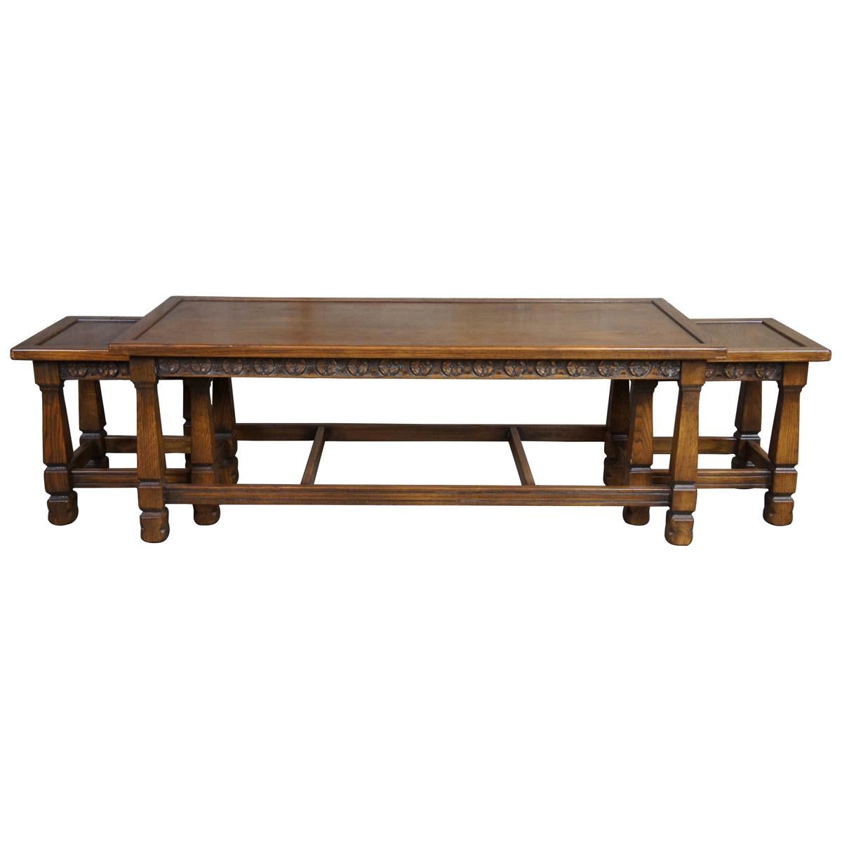 Romweber Viking oak nesting coffee table, circa 1960s. Made from solid oak with a carved apron over square tapered legs connected by jointed stretchers.

Romweber's roots go back to 1879 in Batesville, Indiana. One of the nations oldest case good