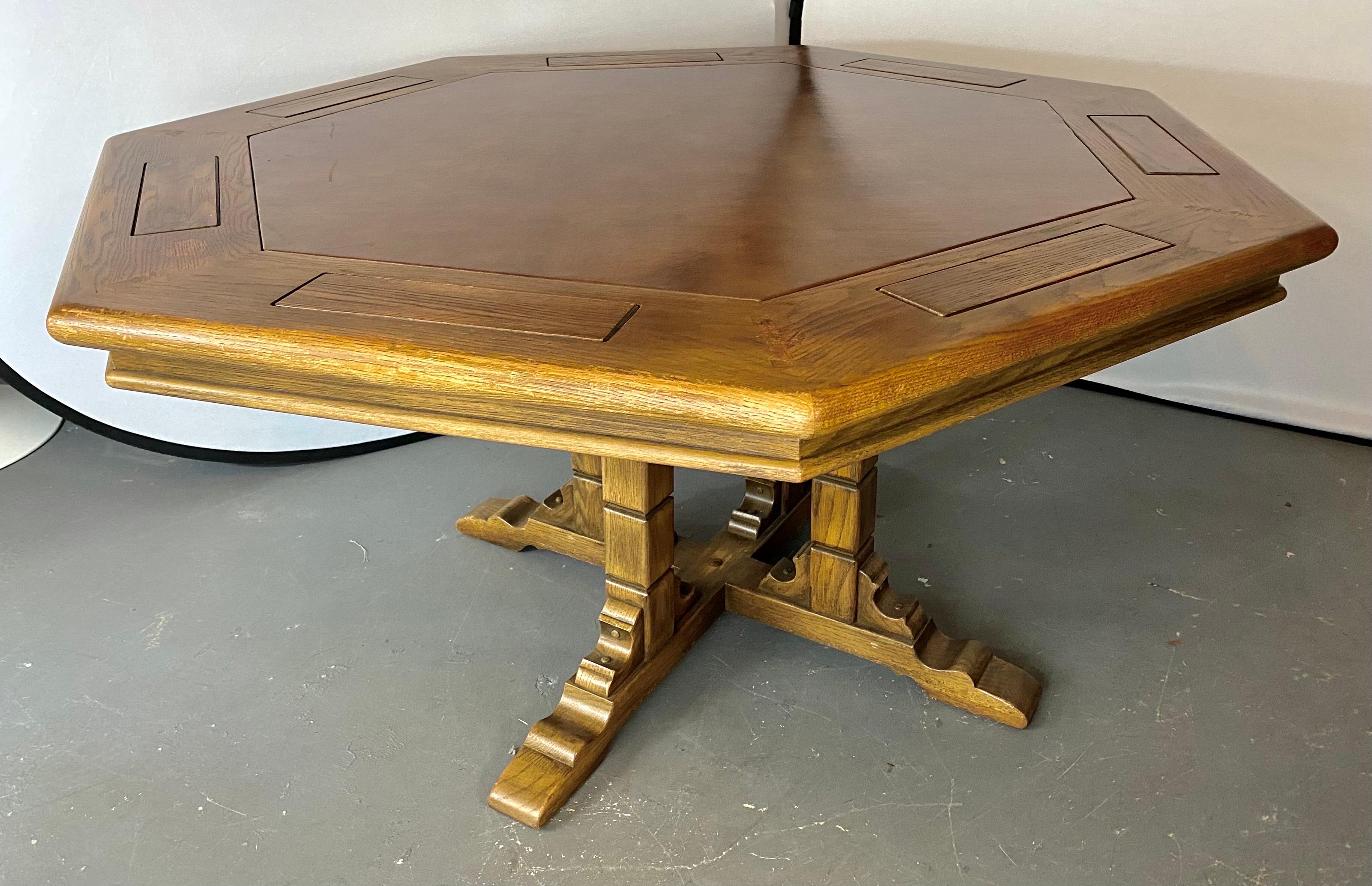 An impressive and rare Romweber Viking oak poker game table and matching chairs. The table features 7 sides and a faux leather / vinyl tooled top in light brown matching nicely the color of the wood. The table has 7 solid oak chip holders or caddies