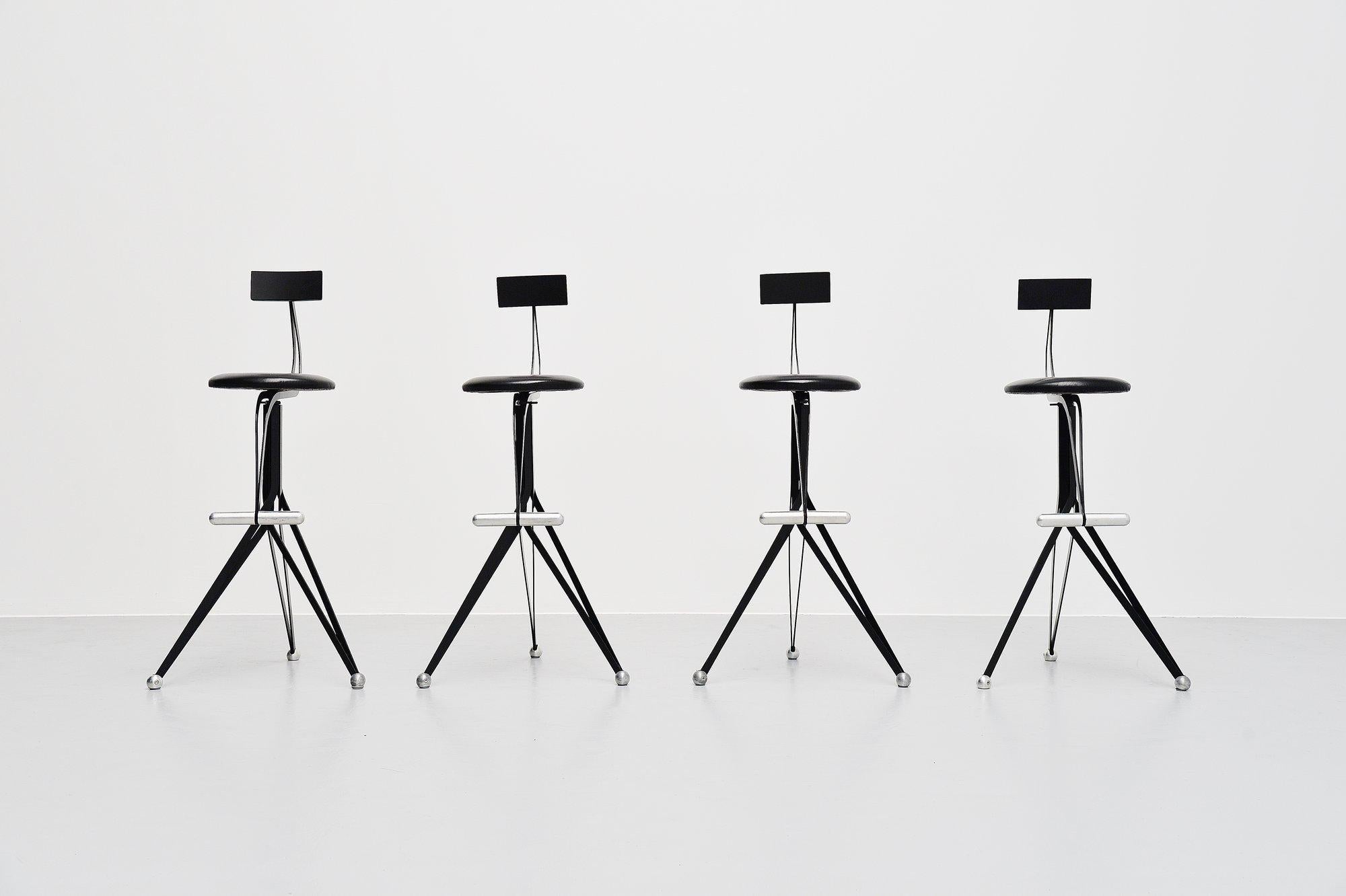 Super rare set of 4 bar stools with back rests designed by the world famous UK designer Ron Arad and manufactured by Zeus, Italy 1994. These stools are from the Anonimus series by Arad and are no longer in production. The stools have a black