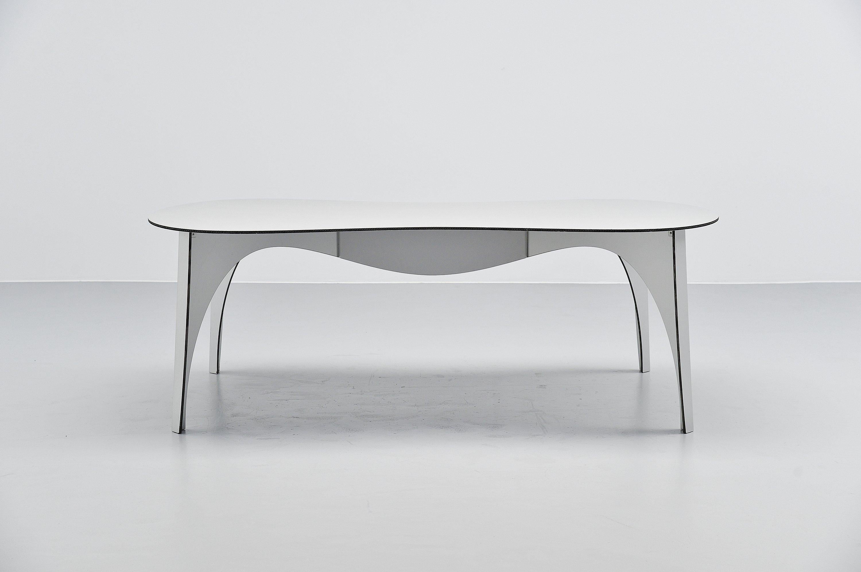 Rare first production dining table designed by Ron Arad for Hidden, Holland 2000. Ron Arad designed a few things for Hidden which was a leading company for contemporary design. They didnt spare on anything and wanted only to be innovative and the