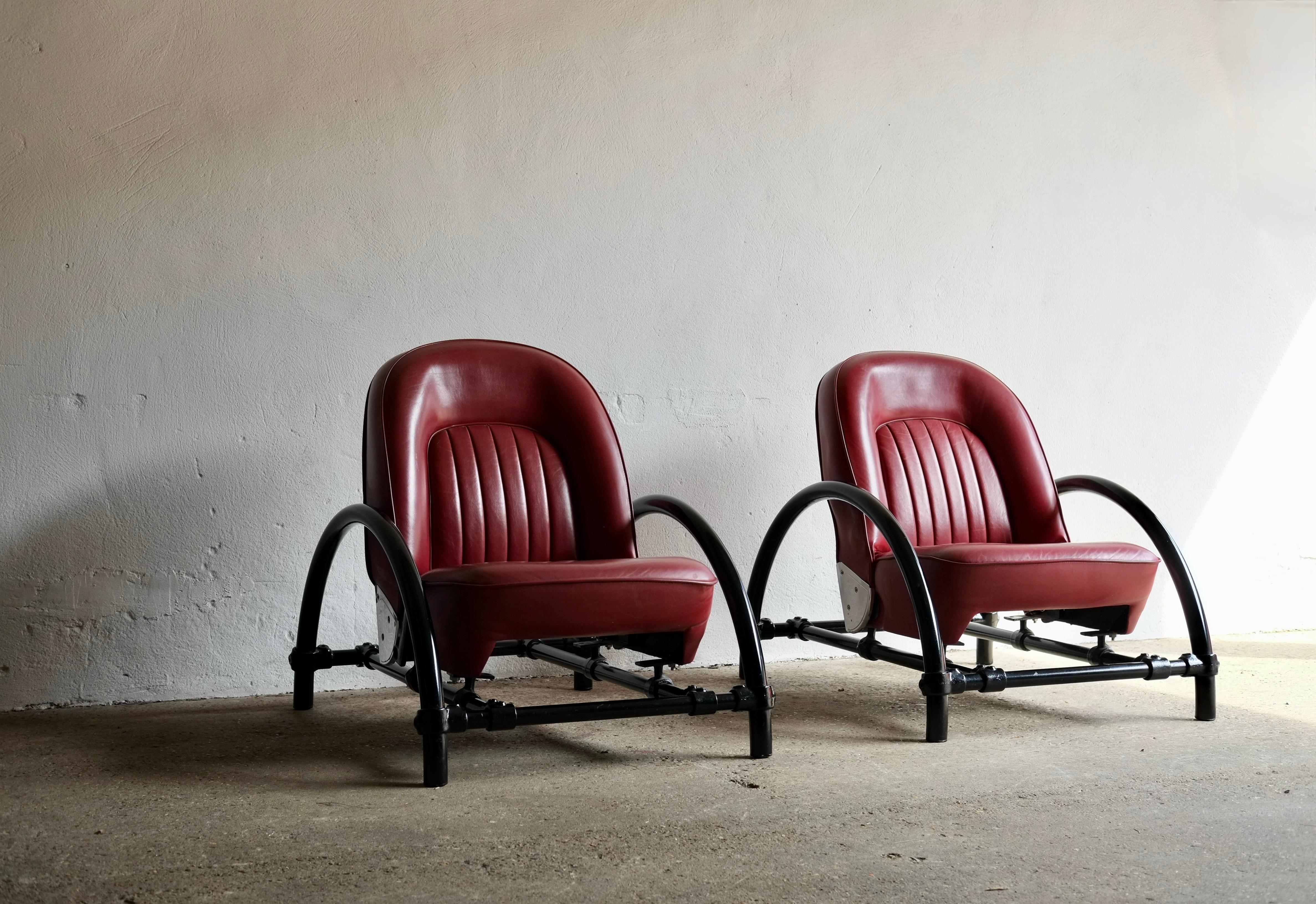 A pair of Rover P6 chairs designed by Ron Arad and produced in the 1980's.

Adjustable leather seats from a Rover P6 supported by a black painted curved steel frame made from a kee klamp milking stool.

Price is for the pair.