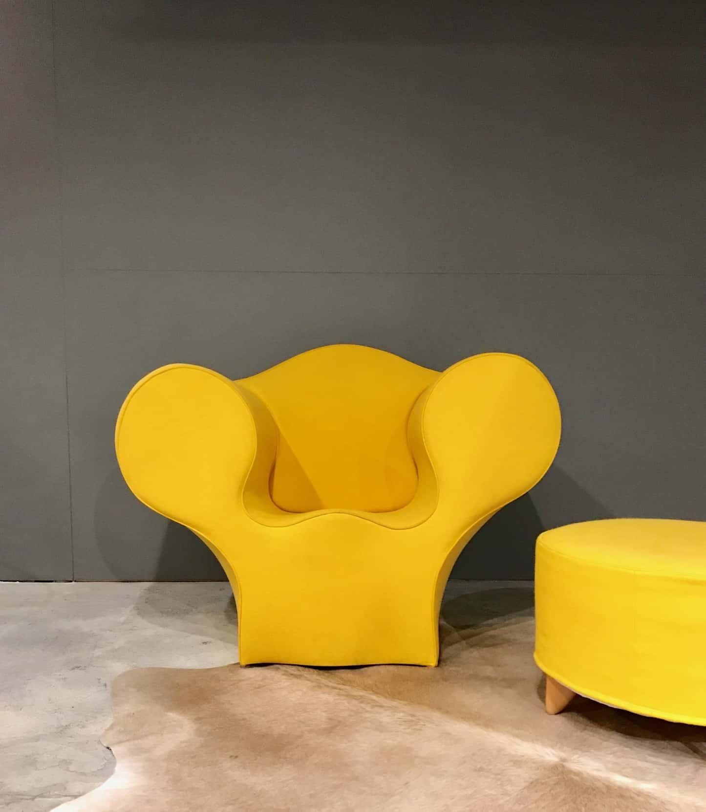 Vibrant in yellow, a soft big easy chair and ottoman, by Ron Arad for Morroso, Italy, 1988.